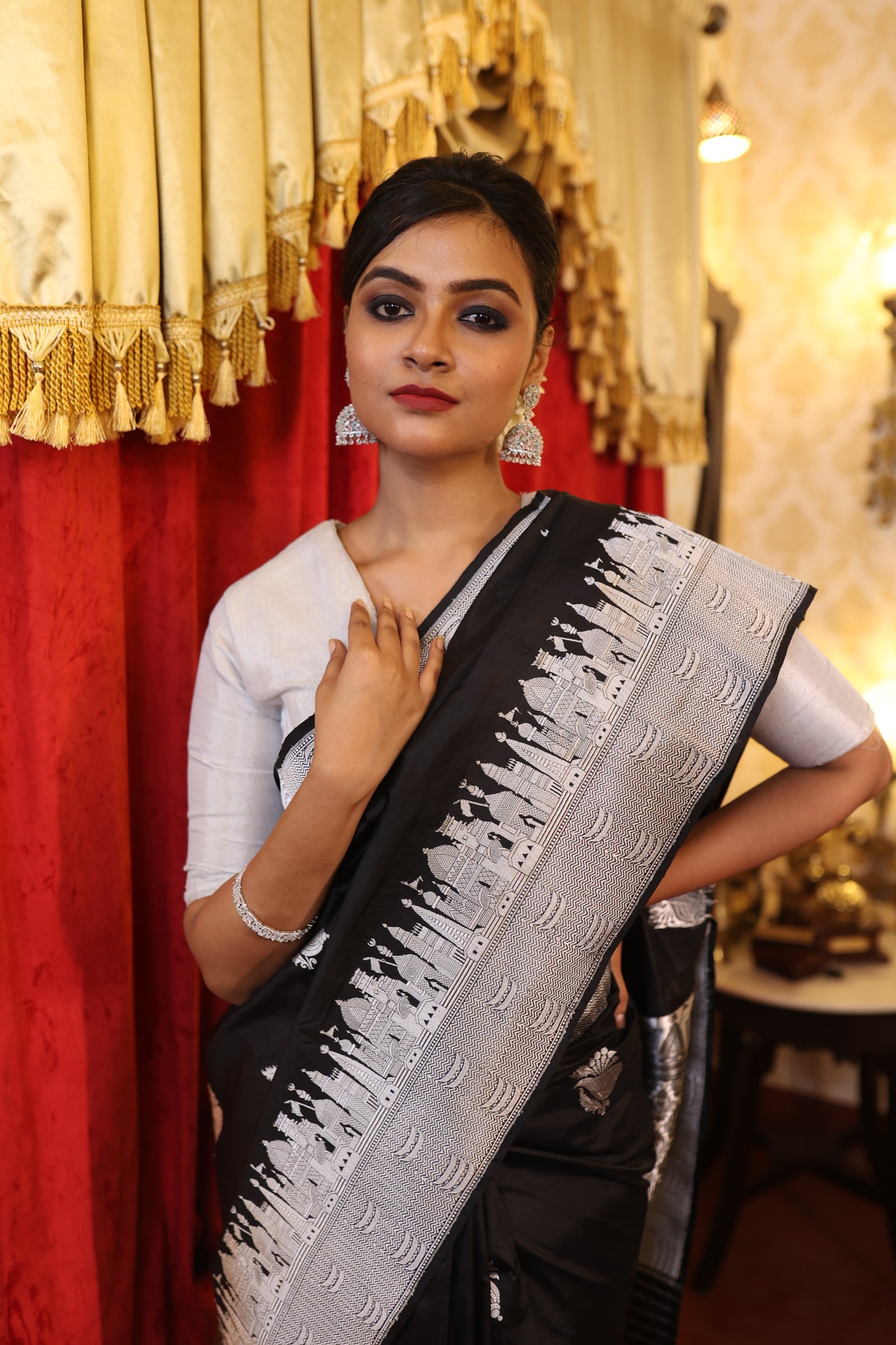 Kashi || Black Pure Katan Handloom Banarasi Saree with all over Metallic Silver Zari Kadhua 'Shankh' motif Buta and 'Kashi Ghat' design Border