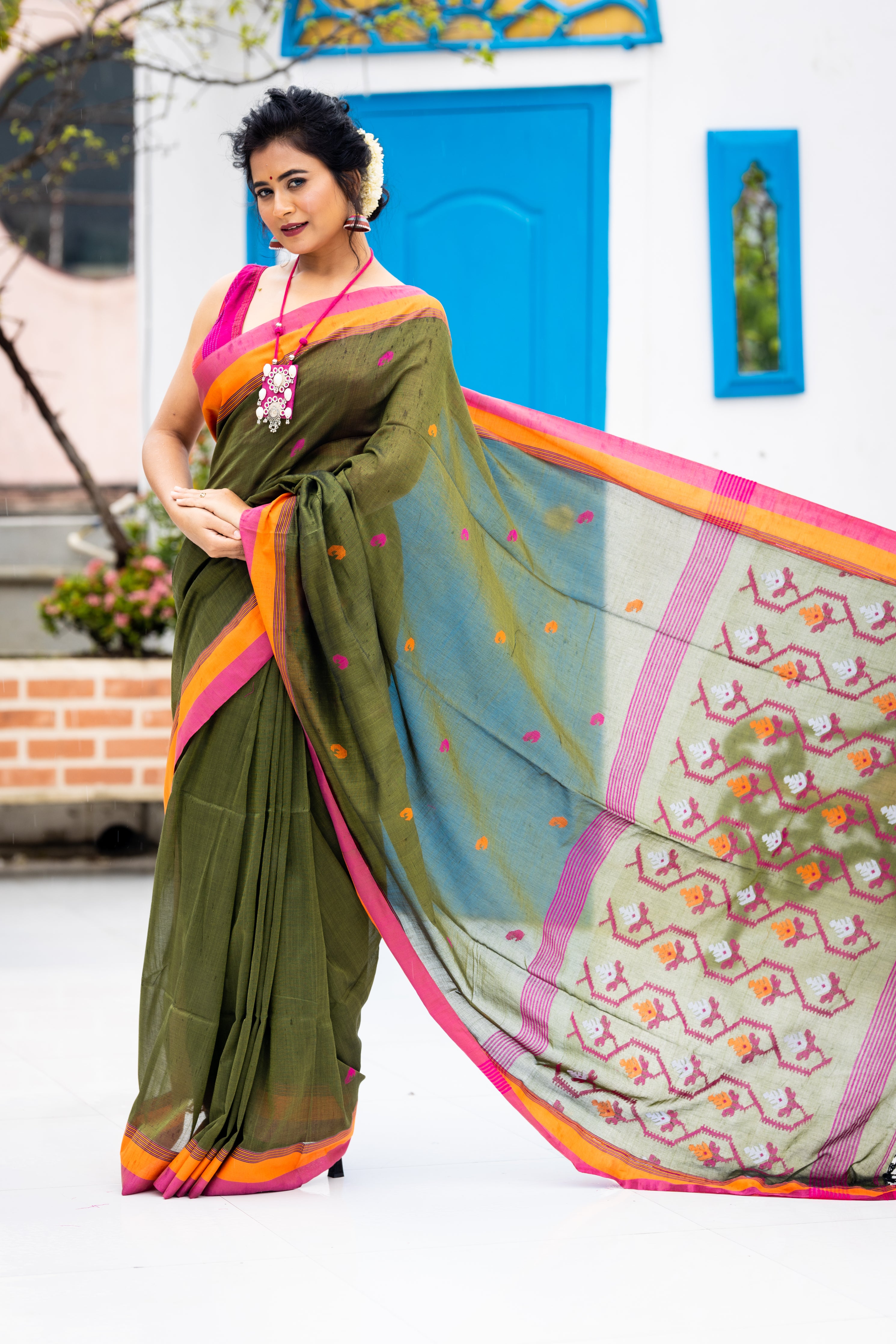 Tamalika || Dark Moss Green Cotton Bengal Handloom Saree with Half Body Plain, Half body Multi-colour Buta, Jamdani Pallu and Orange & Light Onion Pink border