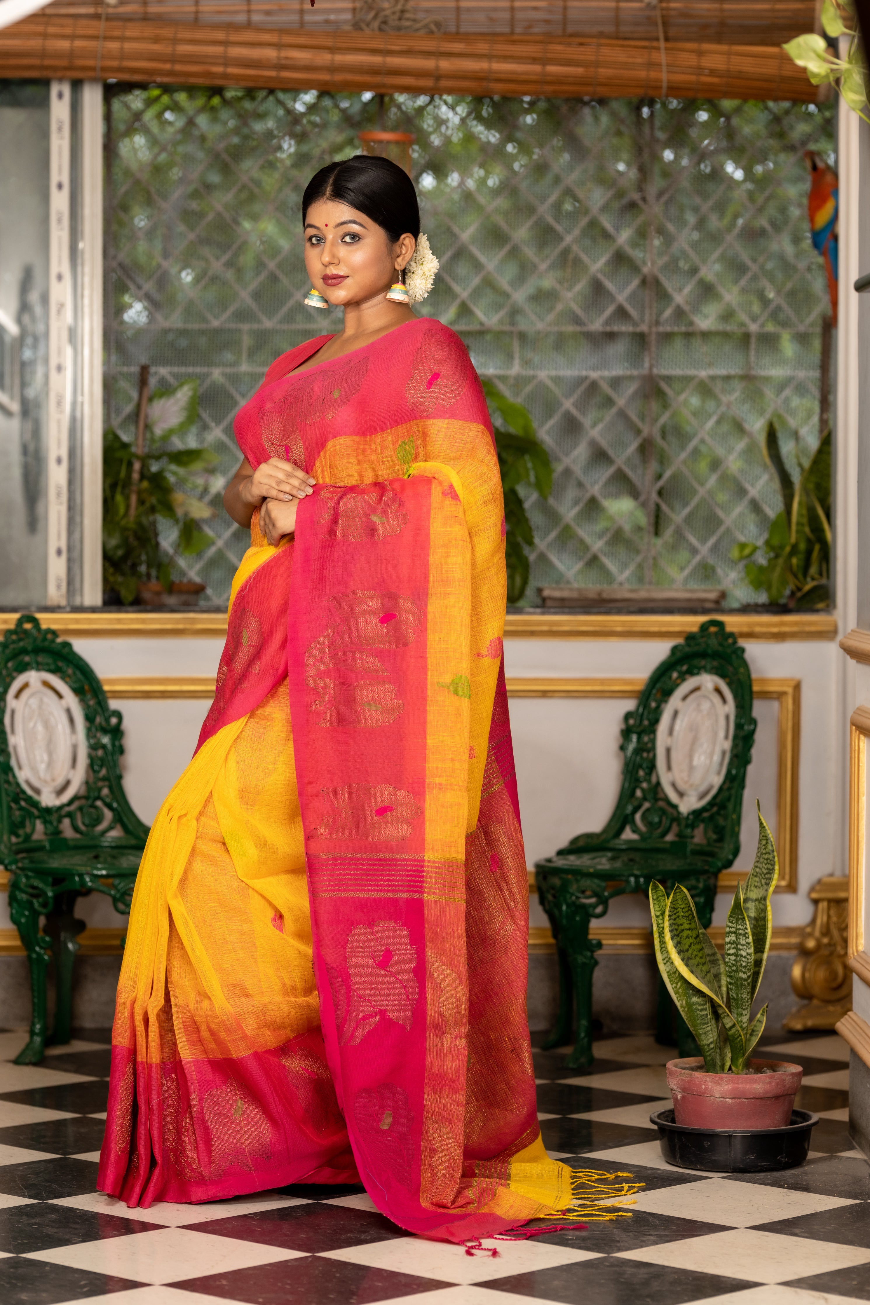 Haridra || Sunflower Yellow Linen Bengal Handloom Saree with all over Multi-colour Buta, Magenta 'Mahapadh' & Antique Gold Zari 'Small Hibiscus' motif Border and Pallu