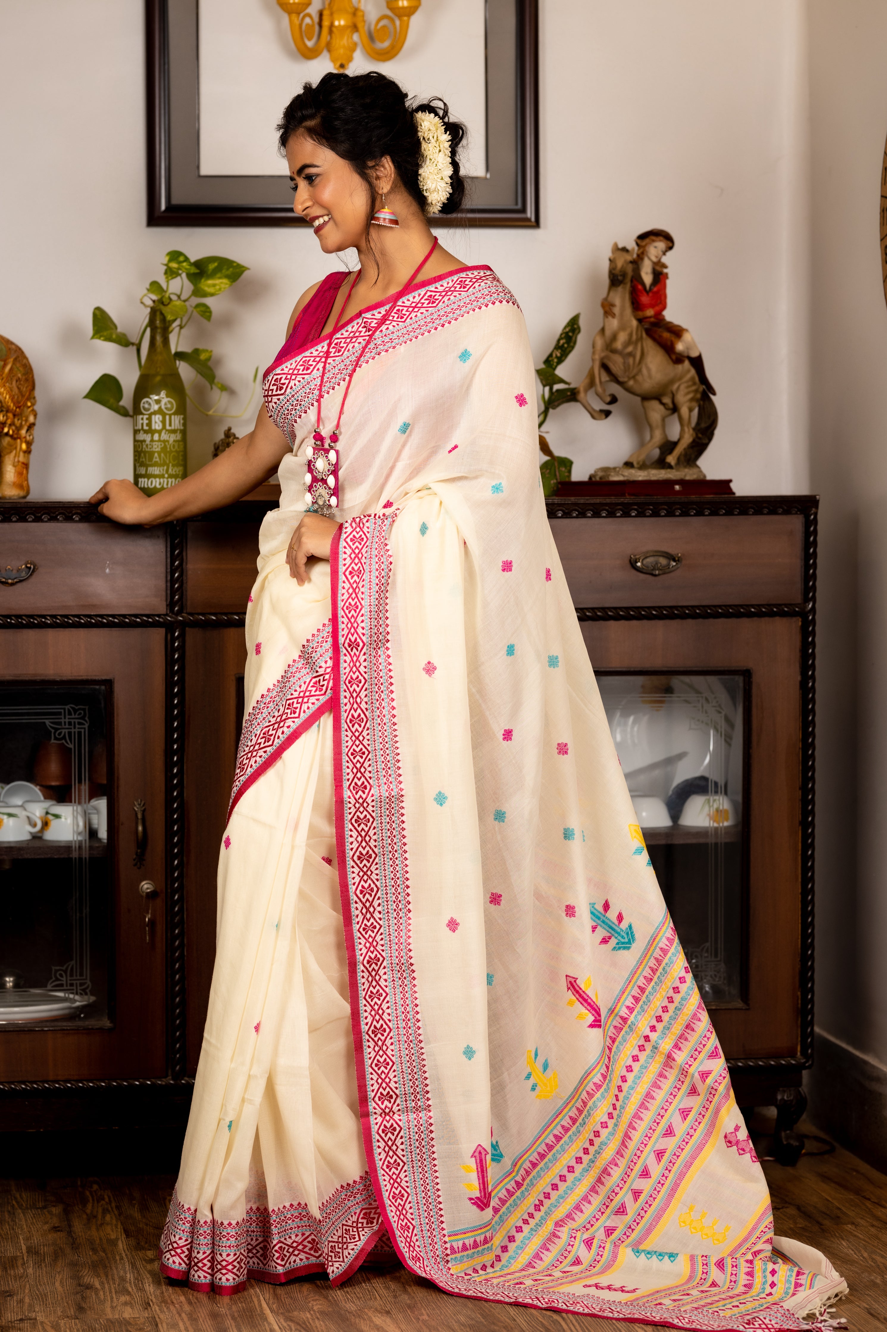 Indira || Off-White Cotton Bengal Handloom Saree with all over Multi-colour Buti, Stripe Pallu and Beetroot Pink Traditional design Border