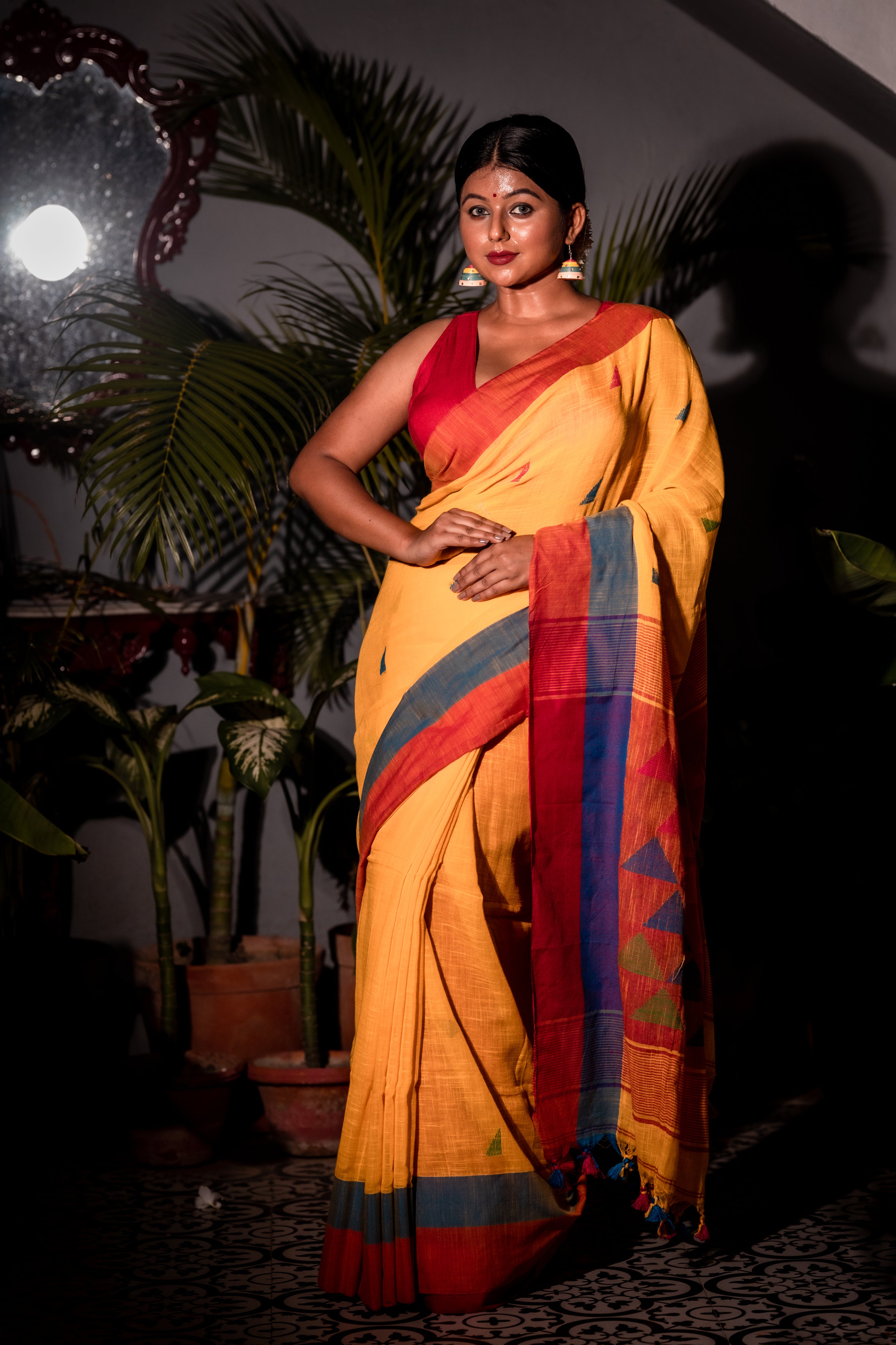 Tribeni || Turmeric Yellow Cotton Bengal Handloom Saree with all over Multi-colour Buta, Dusty Blue & Beet Red Border and 'Temple' motif Pallu