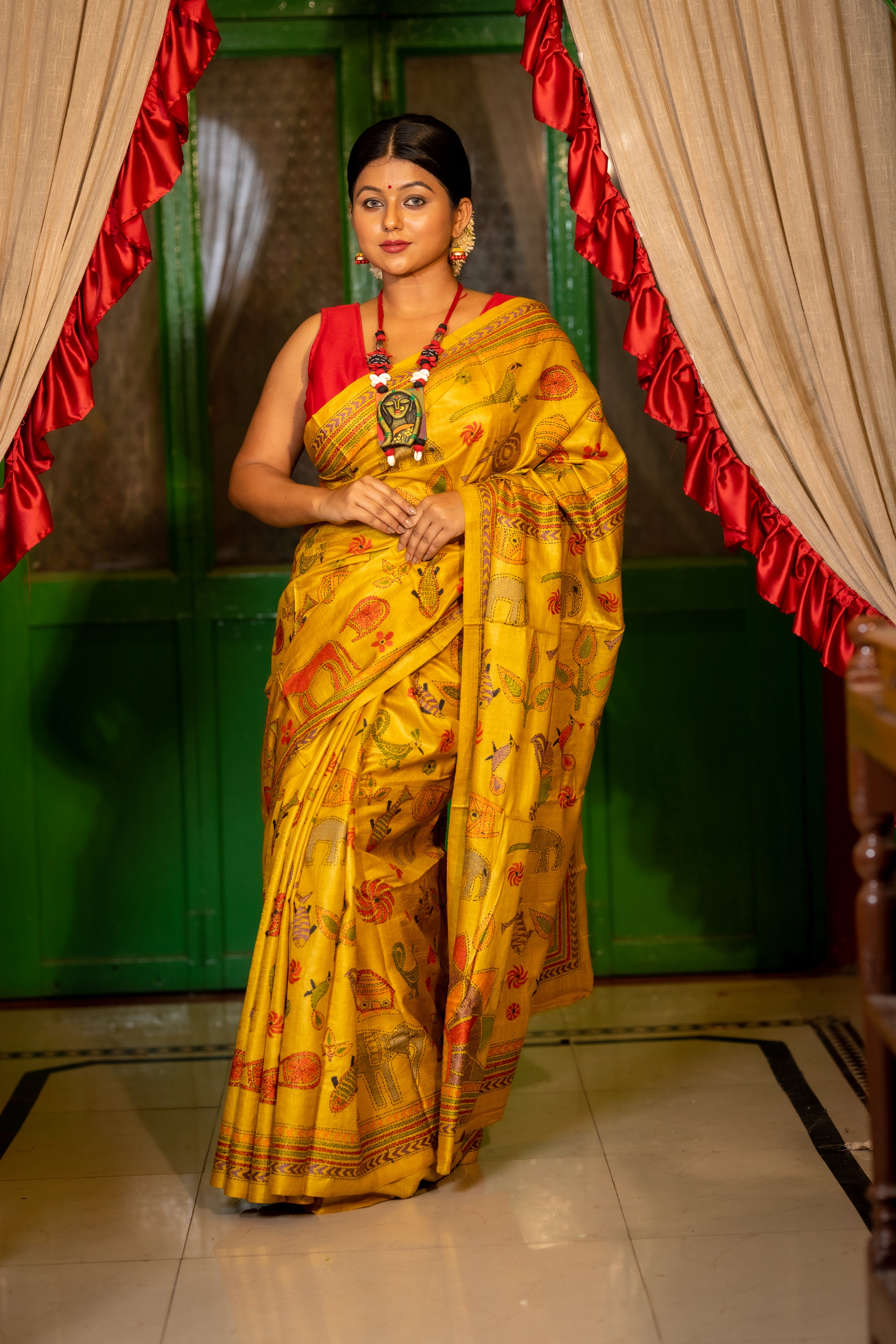 Chitrangada || Ochre Yellow Pure Gachhi Tussar Silk Handloom Kantha Stitch Embroidery Saree with all over Multi-colour Mixed 'Tribal Art' motifs