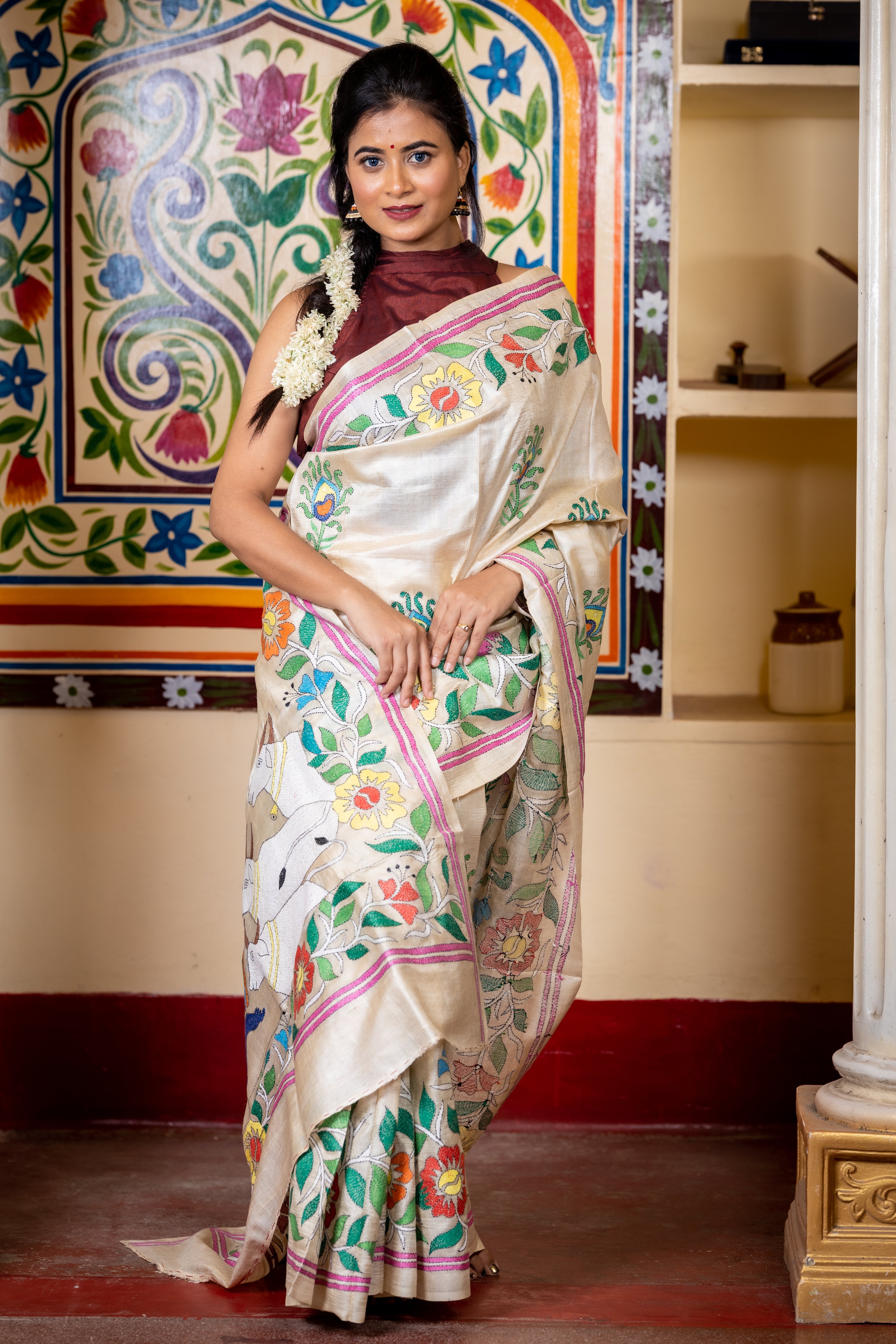 Brindabani || Beige Pure Gachhi Tussar Silk Handloom Kantha Stitch Embroidery Saree with all over Multi-colour 'Morpankh' motif Buta, Floral motif Border and 'Lord Krishna' theme Pallu