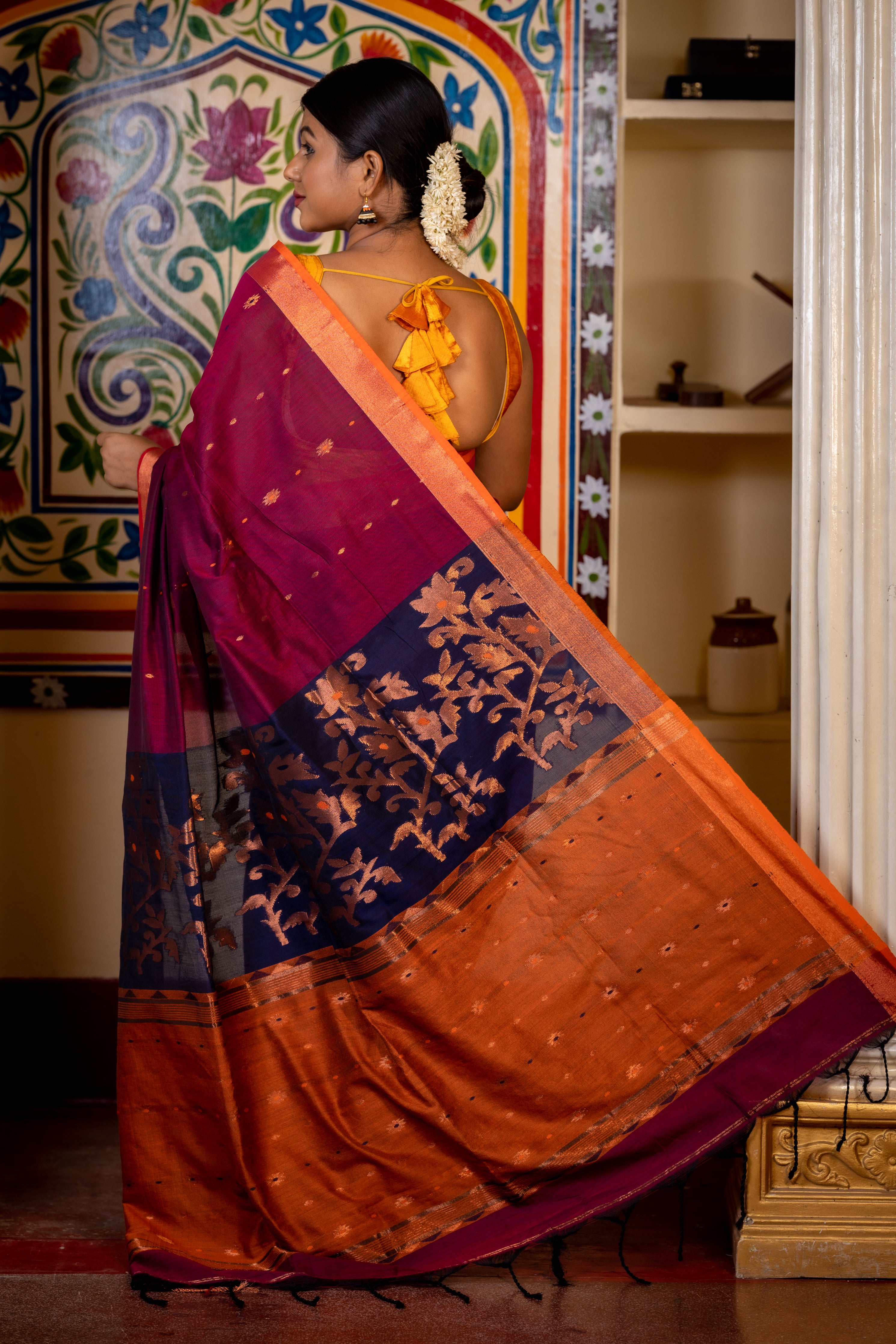 Jamuni || Wine Cotton Bengal Handloom Saree with all over Copper Zari & Multi-colour Buti, Navy Blue & Rust Orange Colour block with Copper Zari Floral motif Pallu and Plain Border