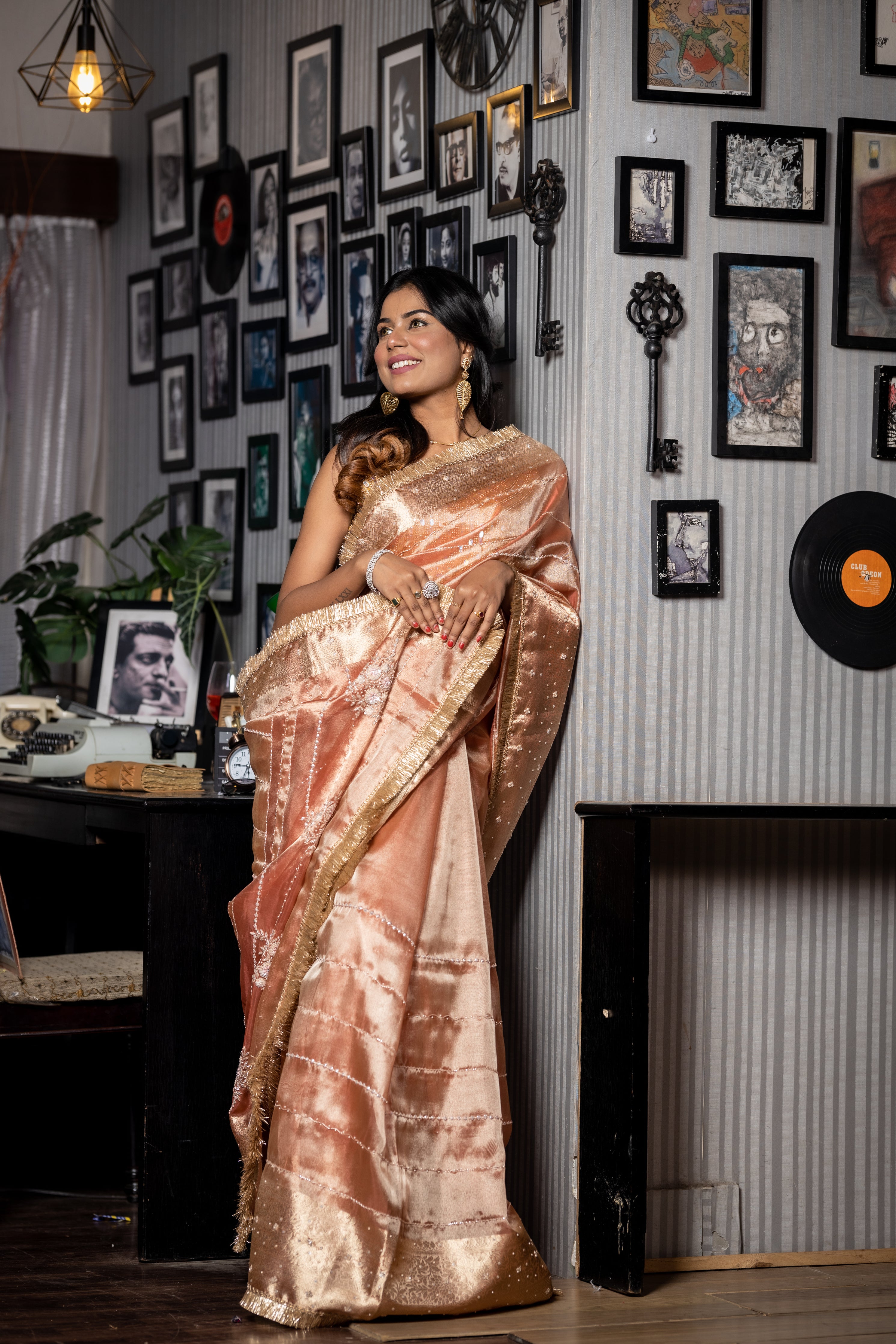 Tanishq || Light & Dark tone Metallic Pale Copper shade Tissue Fancy Saree with all over Cut-dana, Moti, Sequins & Zardosi Handwork Stripe, Traditional Matte Gold Zari Border and Floral motif Pallu with Stone highlights