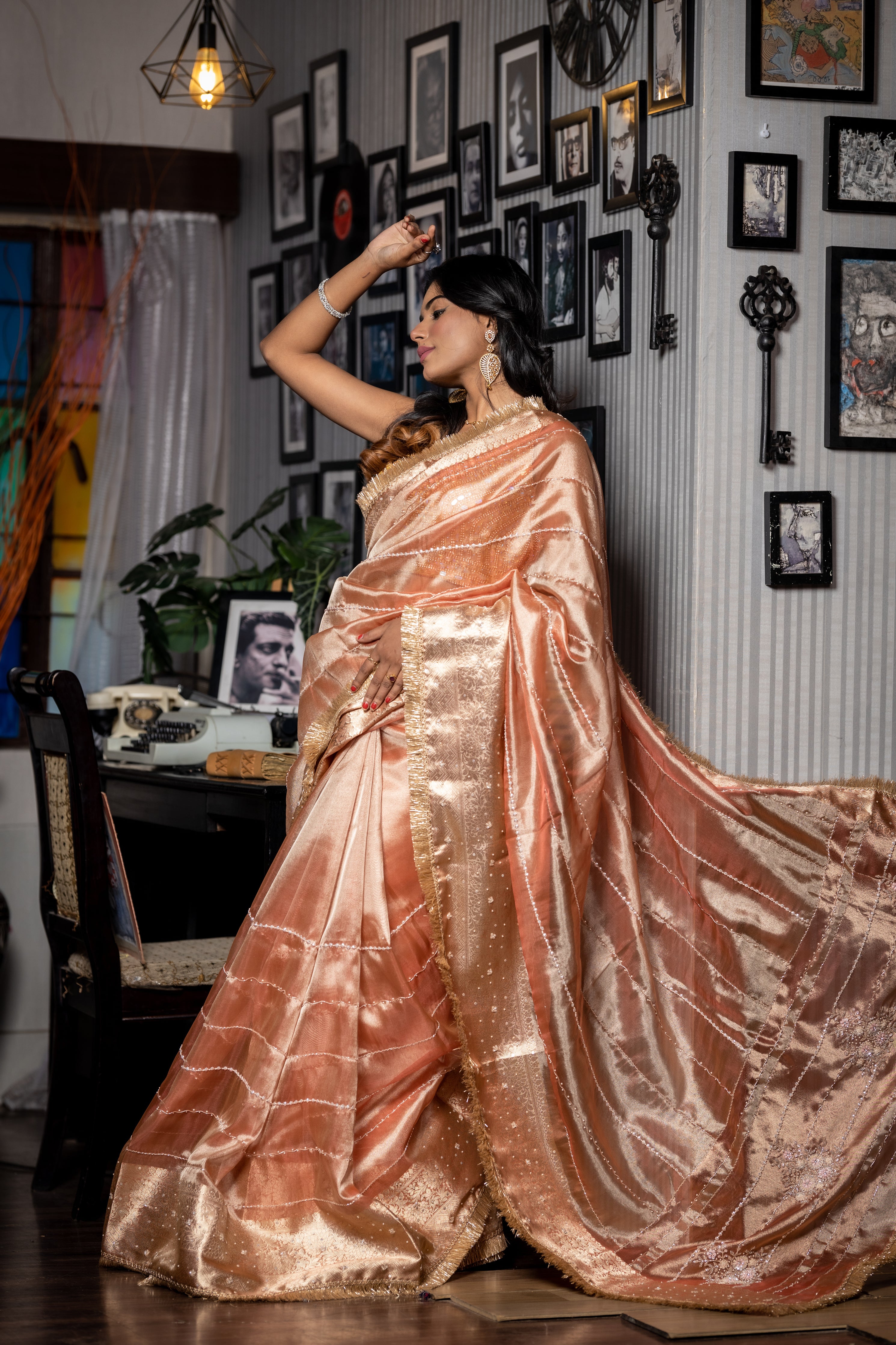 Tanishq || Light & Dark tone Metallic Pale Copper shade Tissue Fancy Saree with all over Cut-dana, Moti, Sequins & Zardosi Handwork Stripe, Traditional Matte Gold Zari Border and Floral motif Pallu with Stone highlights