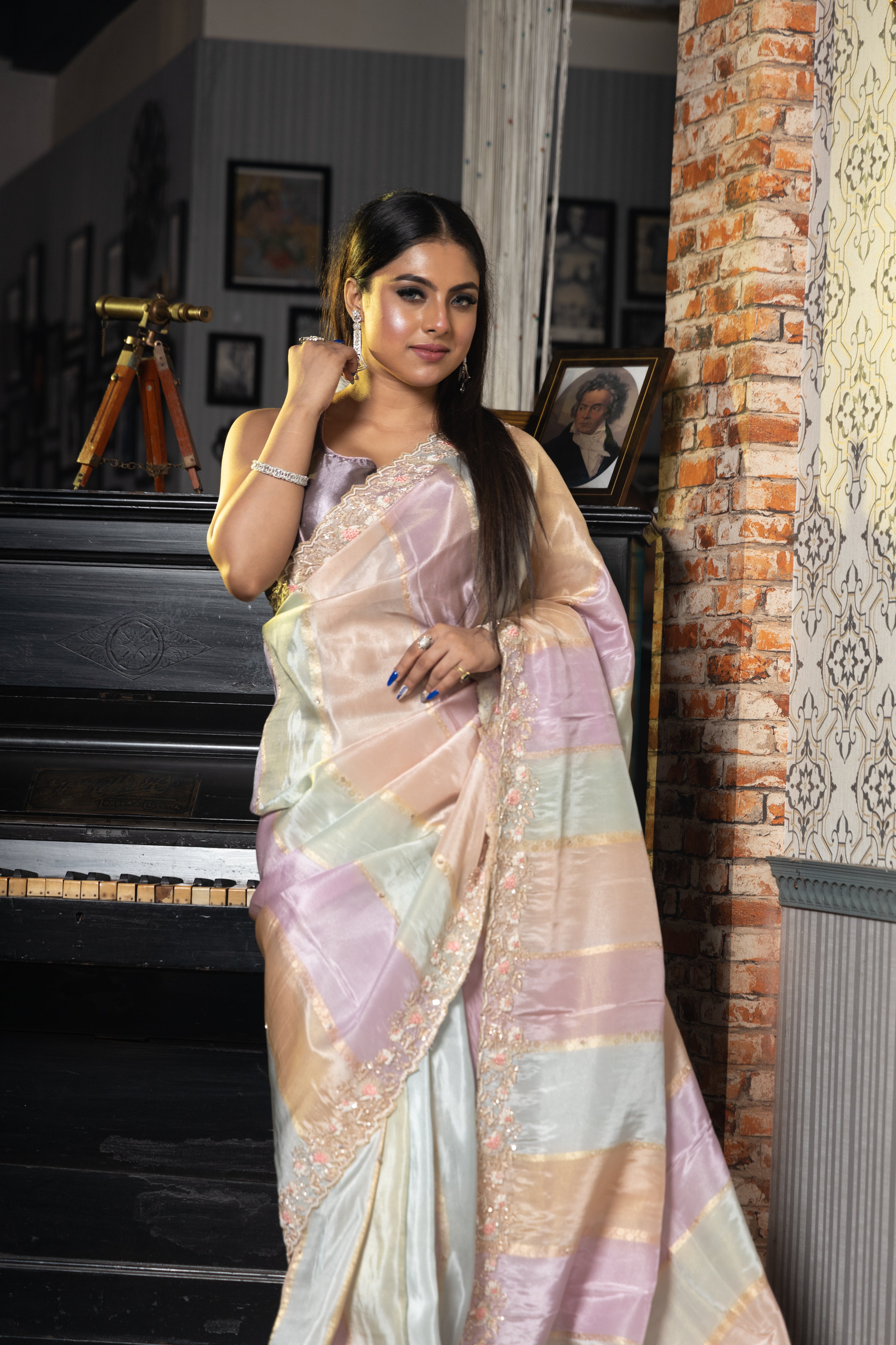 Pastel Hues || Mauve, Ice Blue & Peach with Gold Shimmer finish Tissue Georgette Fancy Saree with all over Matte Gold Zari Stripes, Sequins & Cut-dana Buti and Zari, Cut-dana & Zardosi Handwork with Pink Resham, Sequins & Moti highlights Floral Border