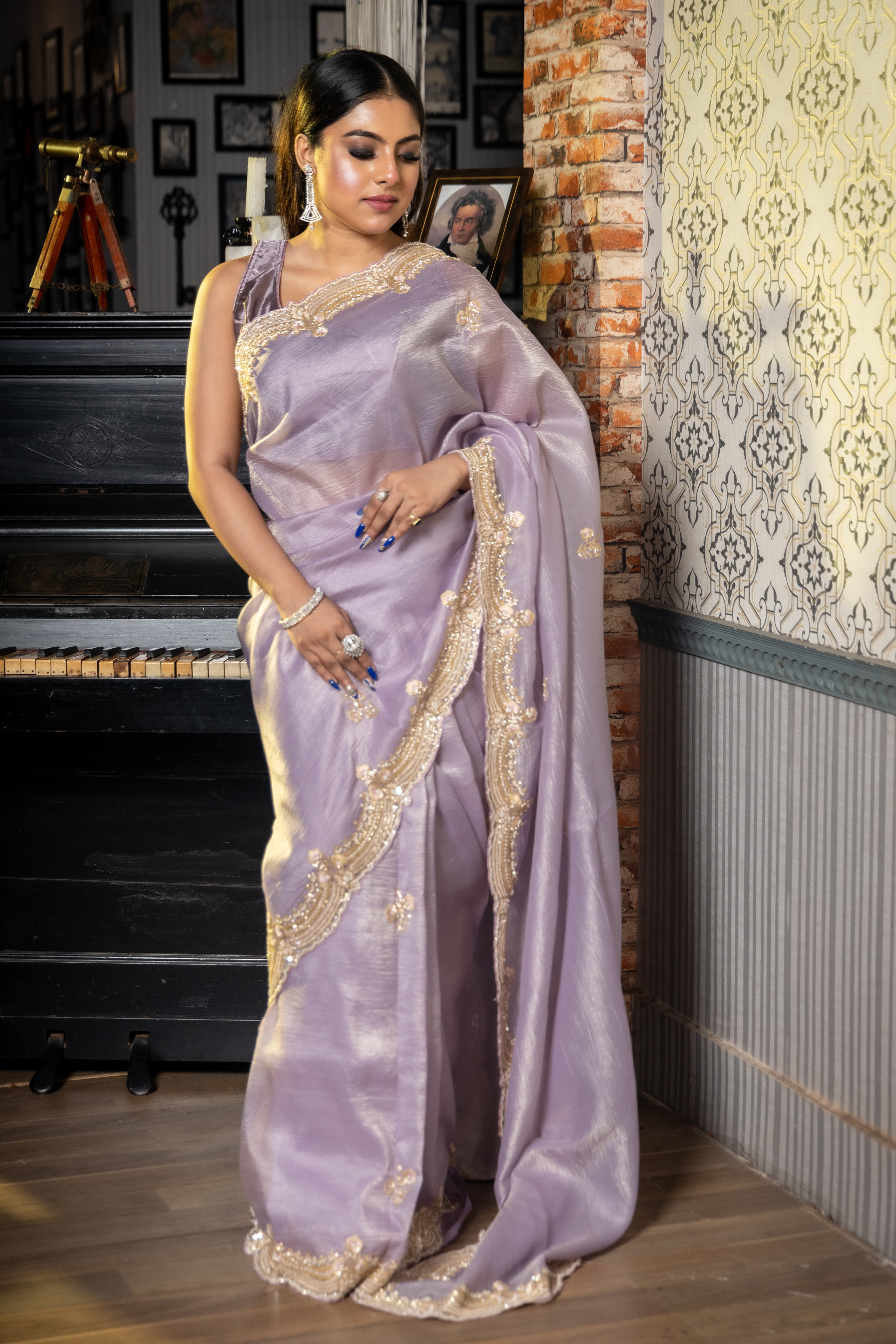 Viola || Lavender & Gold dual tone Crushed Silk Tissue Fancy Saree with all over Cut-dana, Sequins, Moti, Resham & Matte Copper Zardosi Handwork Floral Buta and Border with Stone highlights