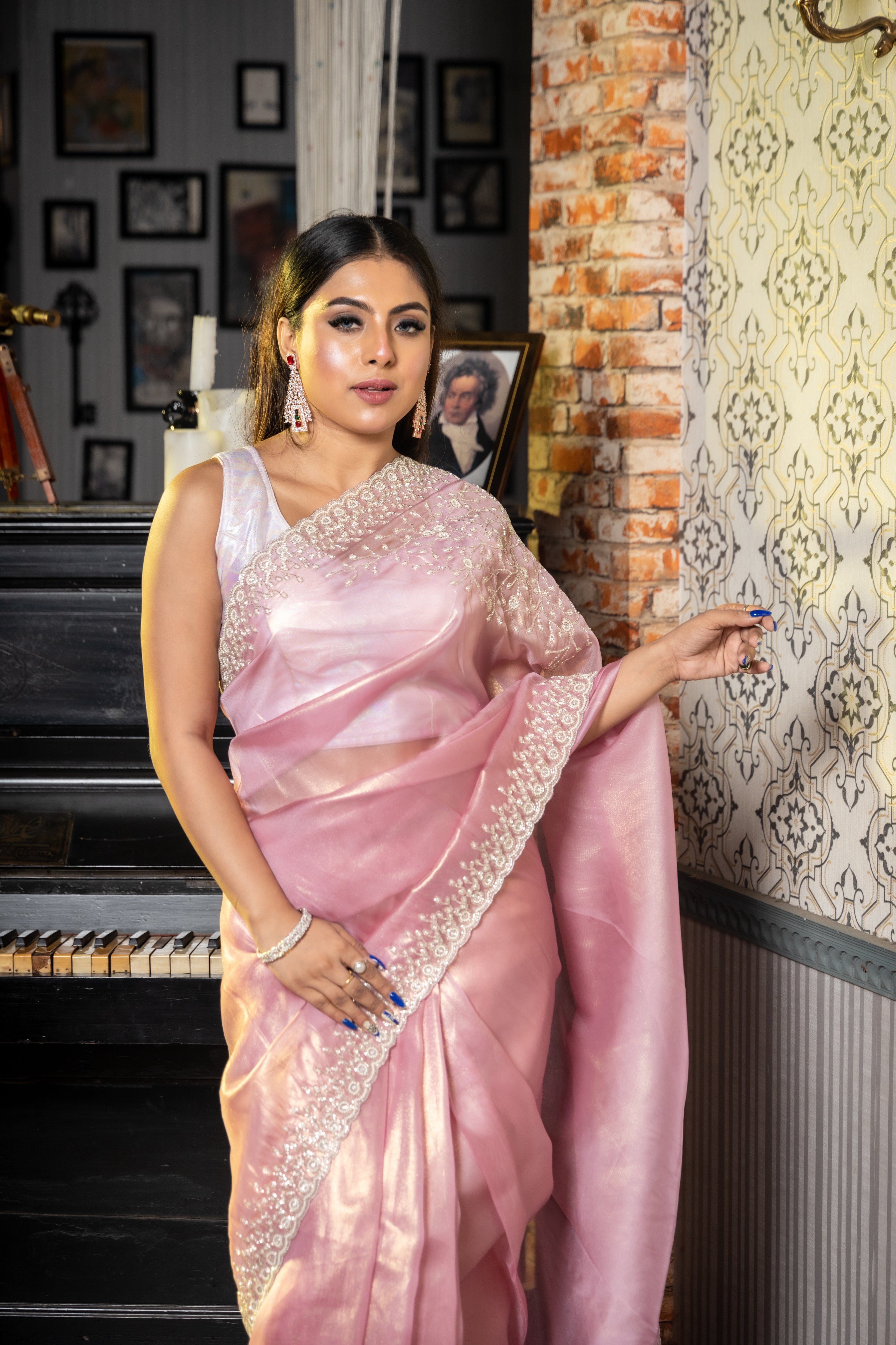 Panache || Onion Pink & Gold dual tone Raina Tissue Fancy Saree with all over Plain body and Silver Cut-dana, Moti & Stone Handwork Floral Border