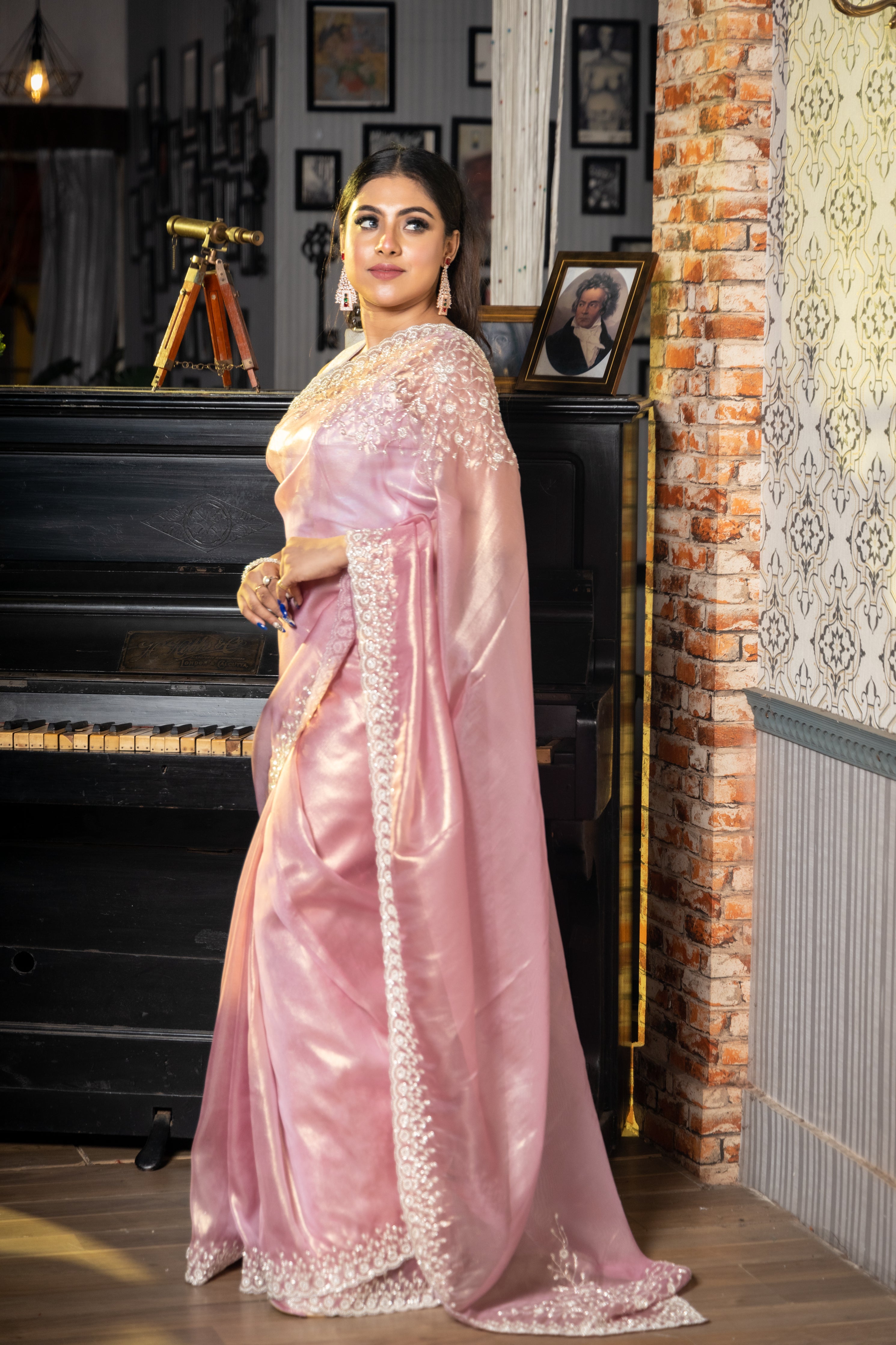 Panache || Onion Pink & Gold dual tone Raina Tissue Fancy Saree with all over Plain body and Silver Cut-dana, Moti & Stone Handwork Floral Border
