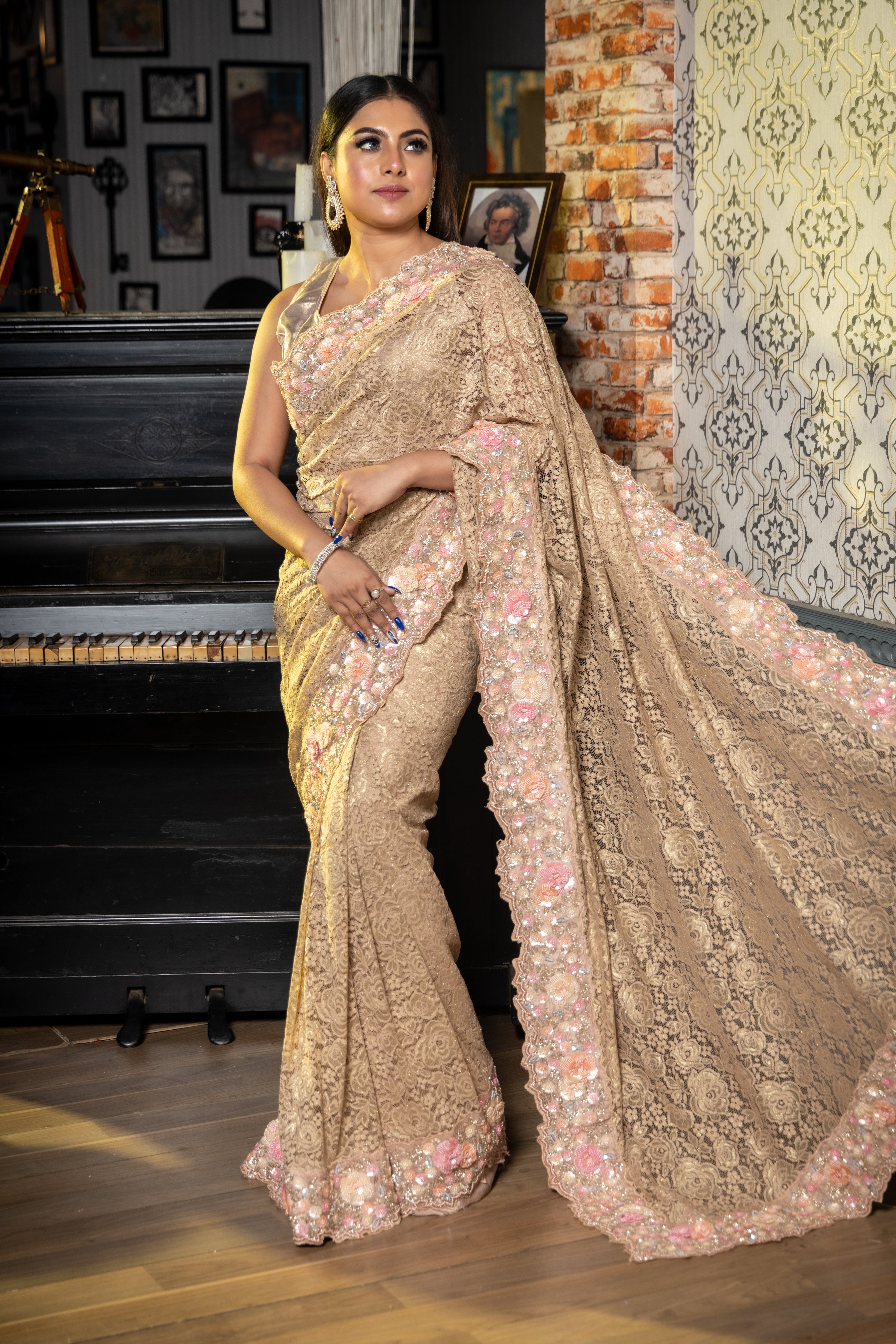 Gulzar || Light Khaki Brown & Matte Gold Zari Chantilly Lace 'Rose' motif Fancy Saree with Plain Body and Multi-colour Sequins, Moti & Cut-dana Handwork Border