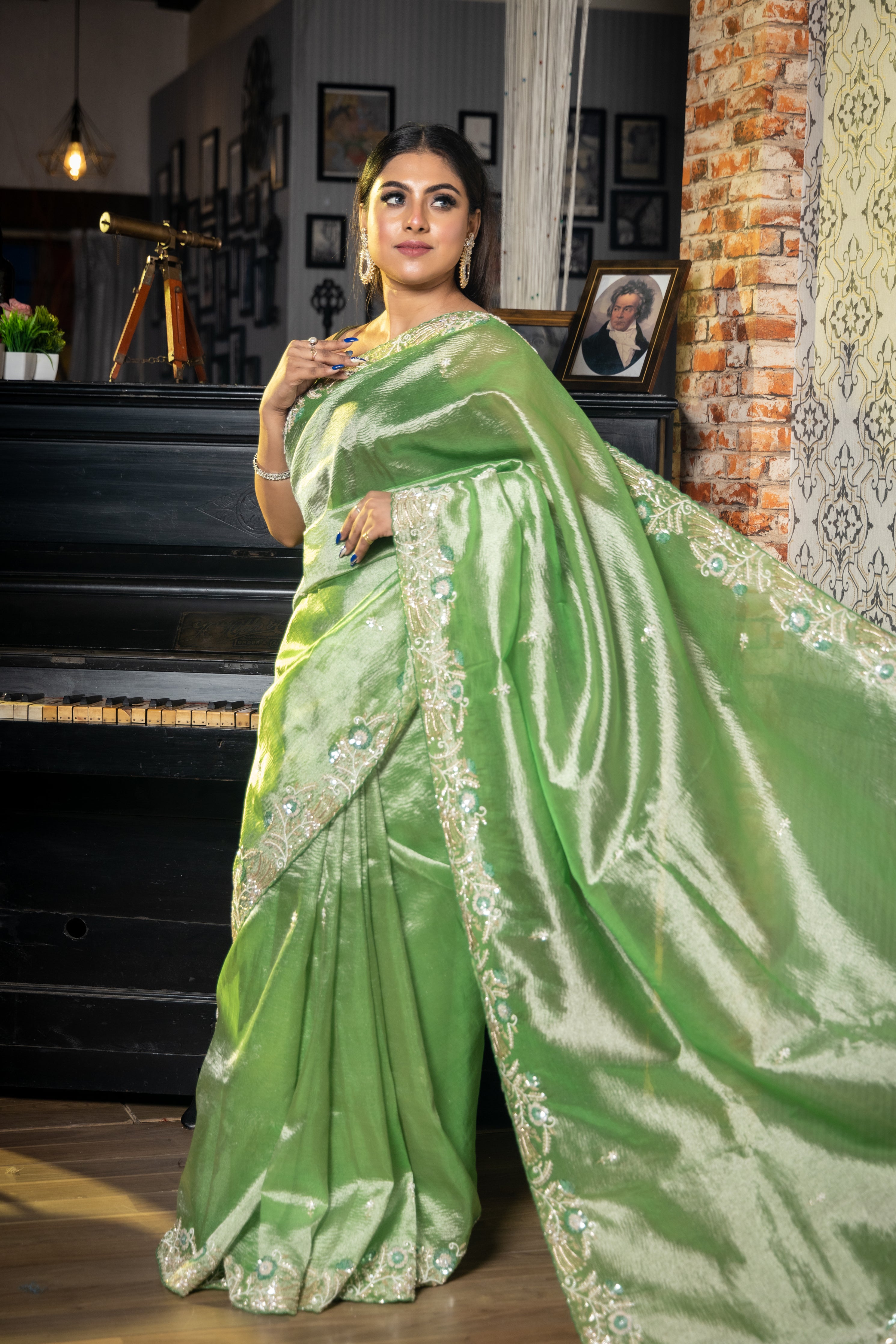 Khatti Imli || Metallic Light Parrot Green Crushed Tissue Fancy Saree with all over Moti, Cut-dana & Sequins Handwork Floral Buti and Border with Stone, Matte Copper Zari & Zardosi highlights