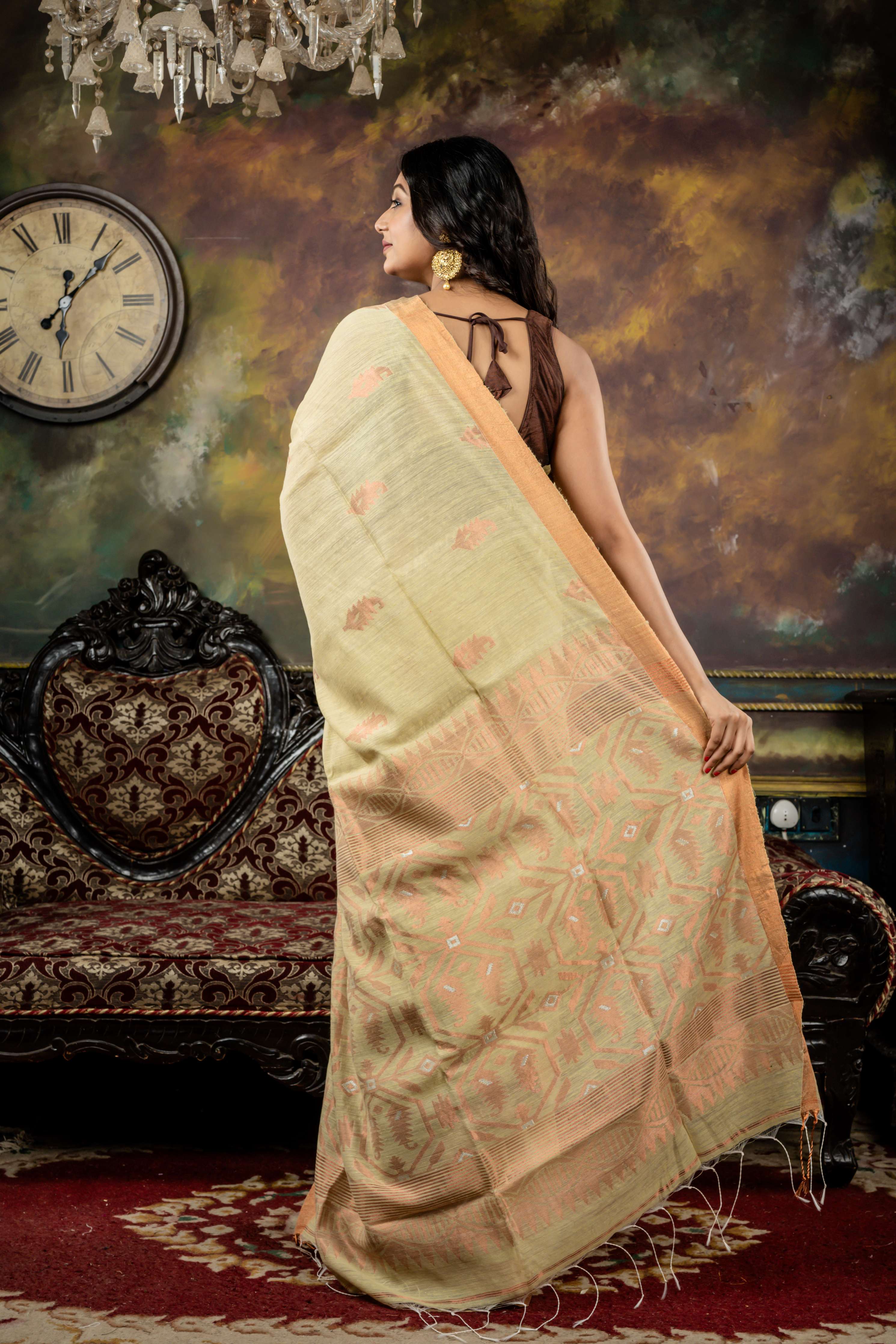 Giribala || Light Pista Green Matka Bengal Handloom Saree with all over Copper Zari Buta and 'Karat motif Pallu with Silver Zari highlights