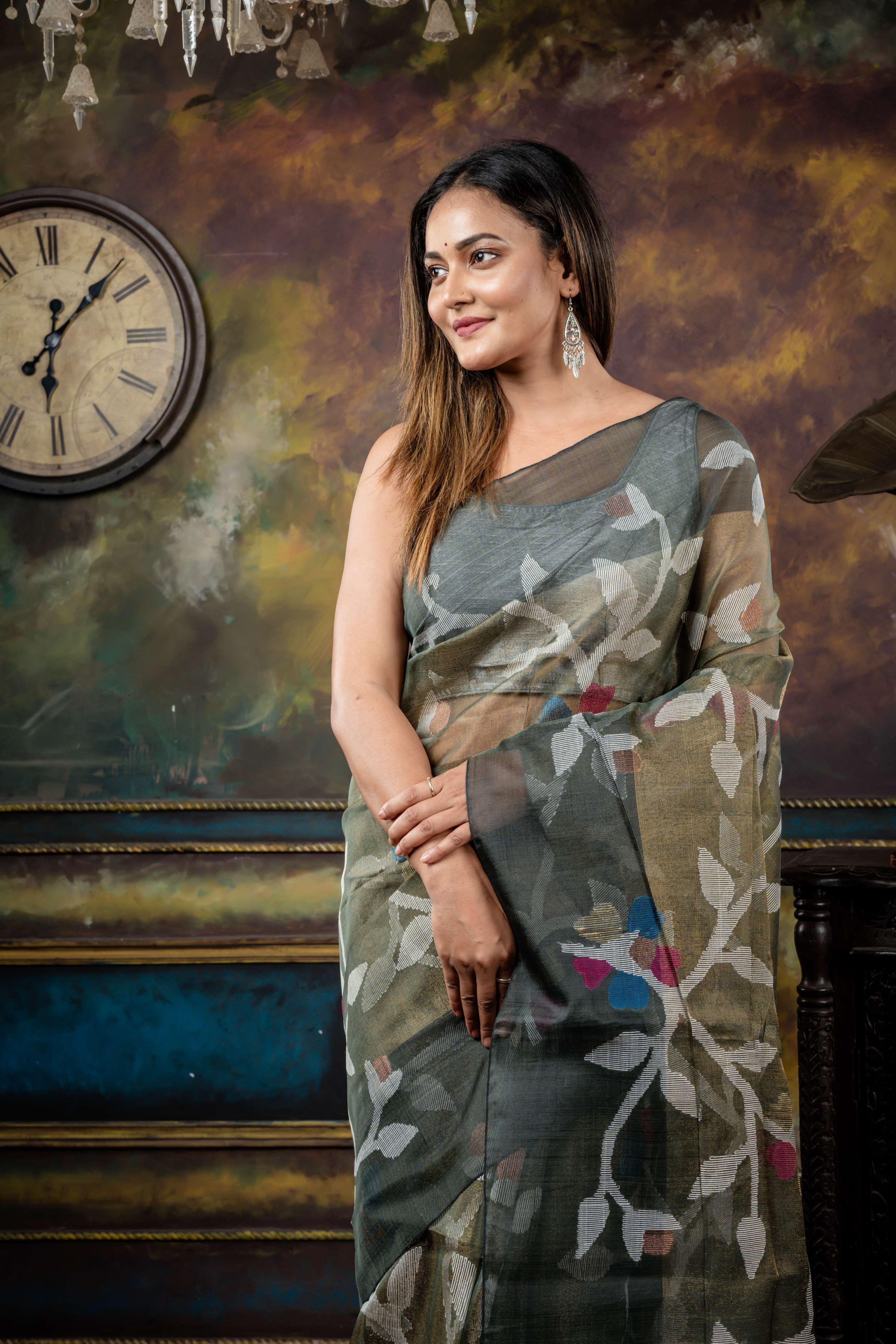 Keya || Sage Green & Antique Gold dual tone Premium Tissue Muslin Bengal Handloom Saree with all over Multi-colour & Copper Zari Floral Jamdani Body & Pallu and Dark Grey 'Mahapadh' Border