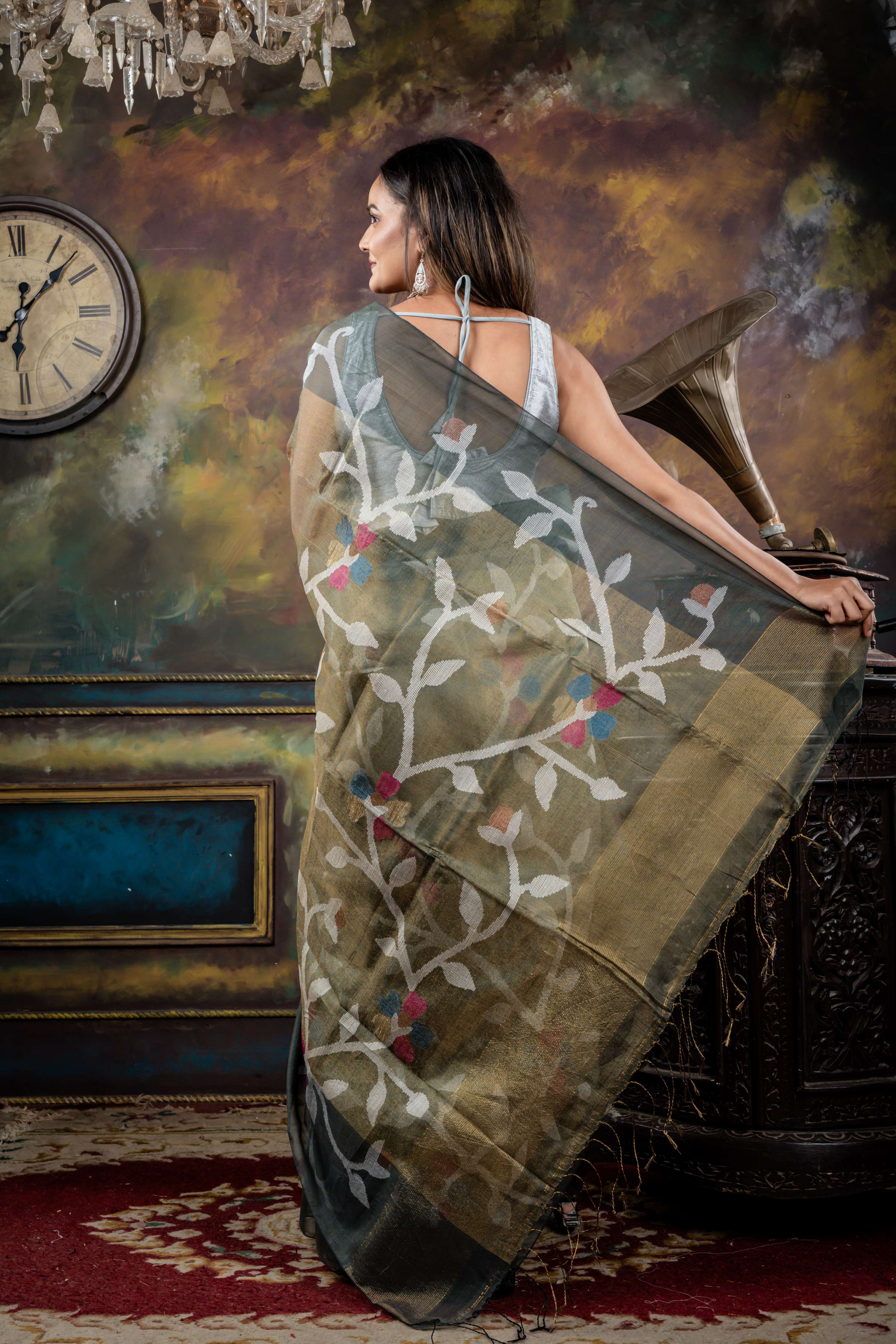 Keya || Sage Green & Antique Gold dual tone Premium Tissue Muslin Bengal Handloom Saree with all over Multi-colour & Copper Zari Floral Jamdani Body & Pallu and Dark Grey 'Mahapadh' Border