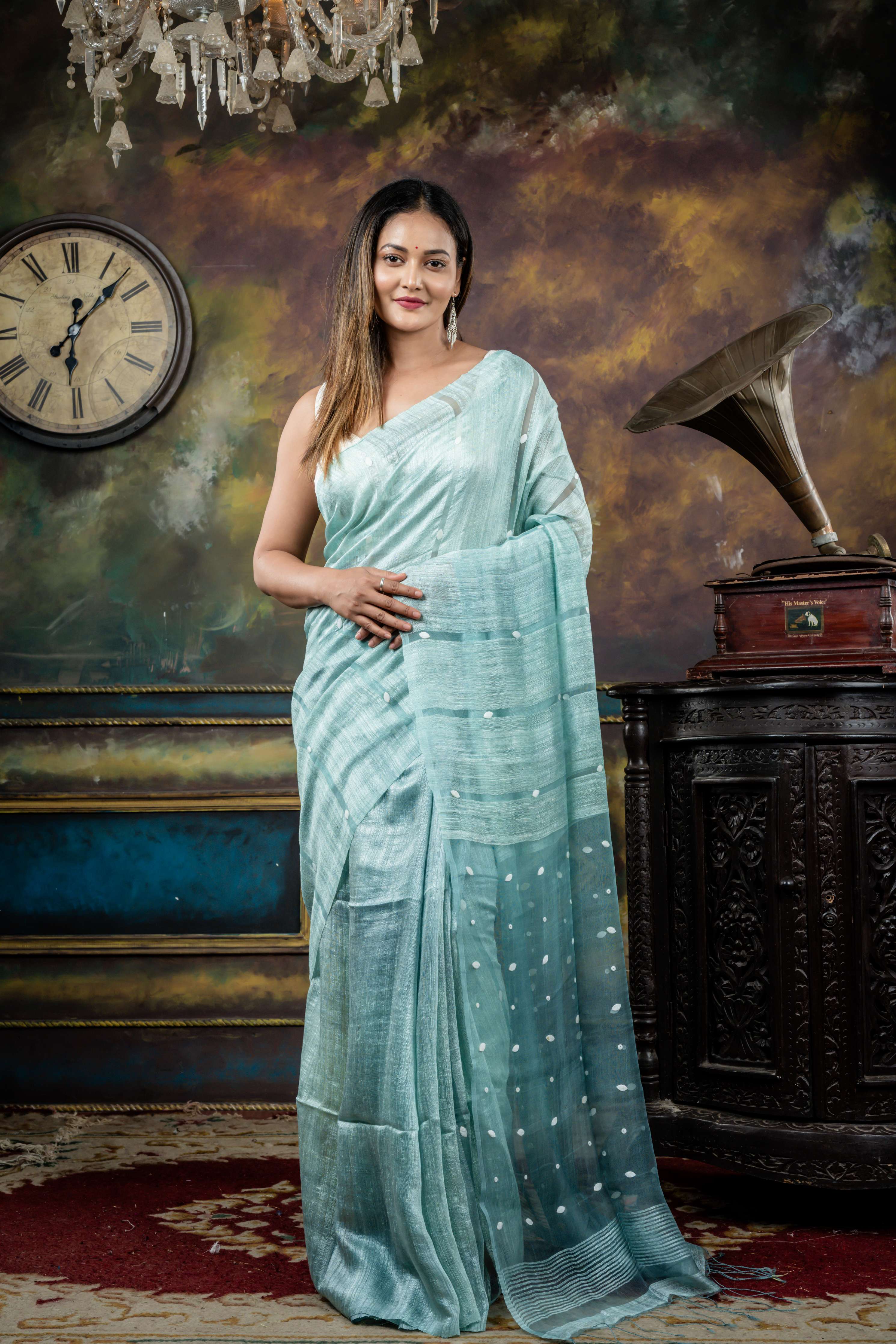 Trishna || Ice Blue Matka Bengal Handloom Saree with Half Body Plain, Half Body woven Sea Shell highlights on Muslin block Stripes and Sea Shell embellished Muslin Pallu