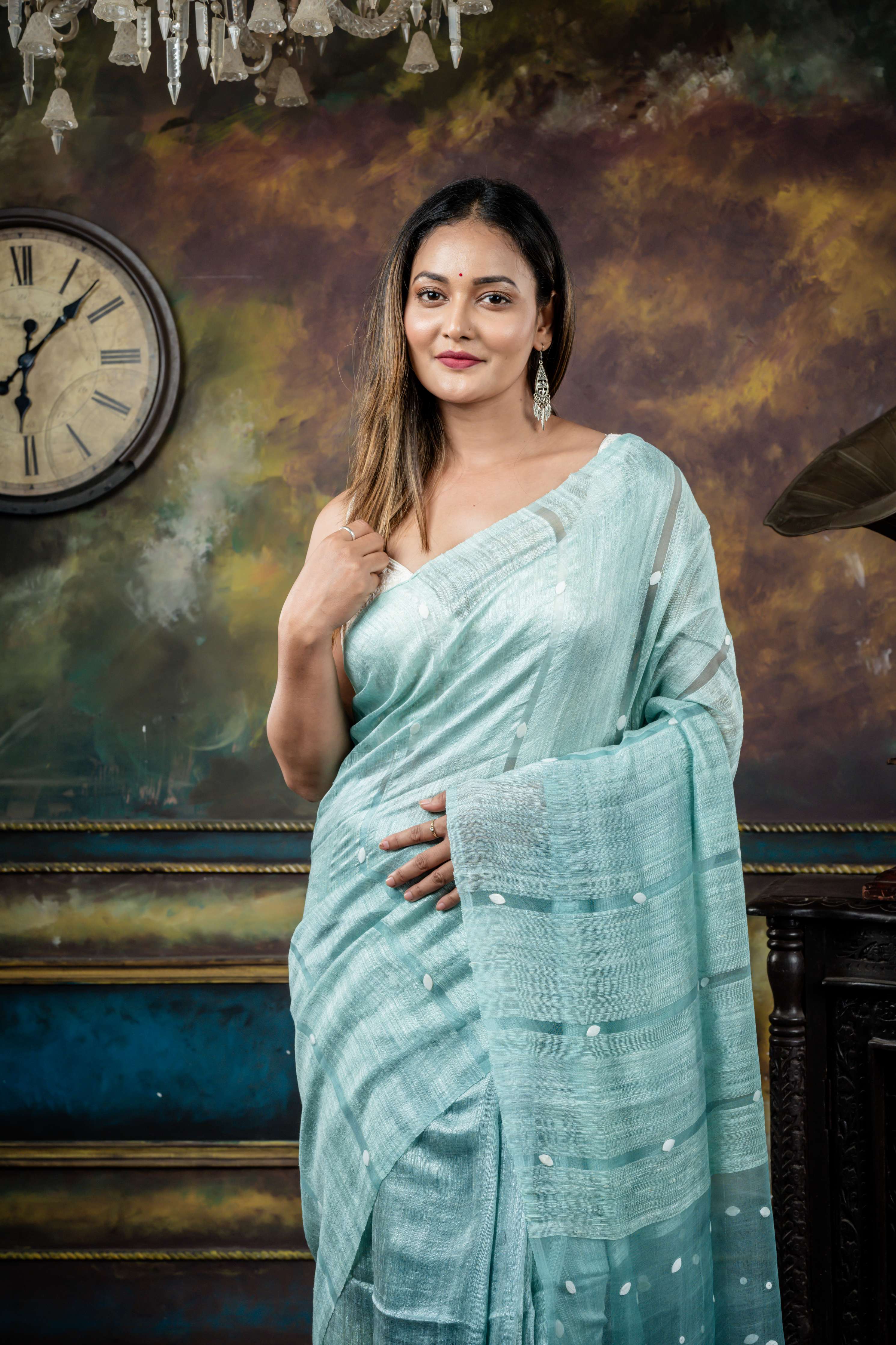 Trishna || Ice Blue Matka Bengal Handloom Saree with Half Body Plain, Half Body woven Sea Shell highlights on Muslin block Stripes and Sea Shell embellished Muslin Pallu
