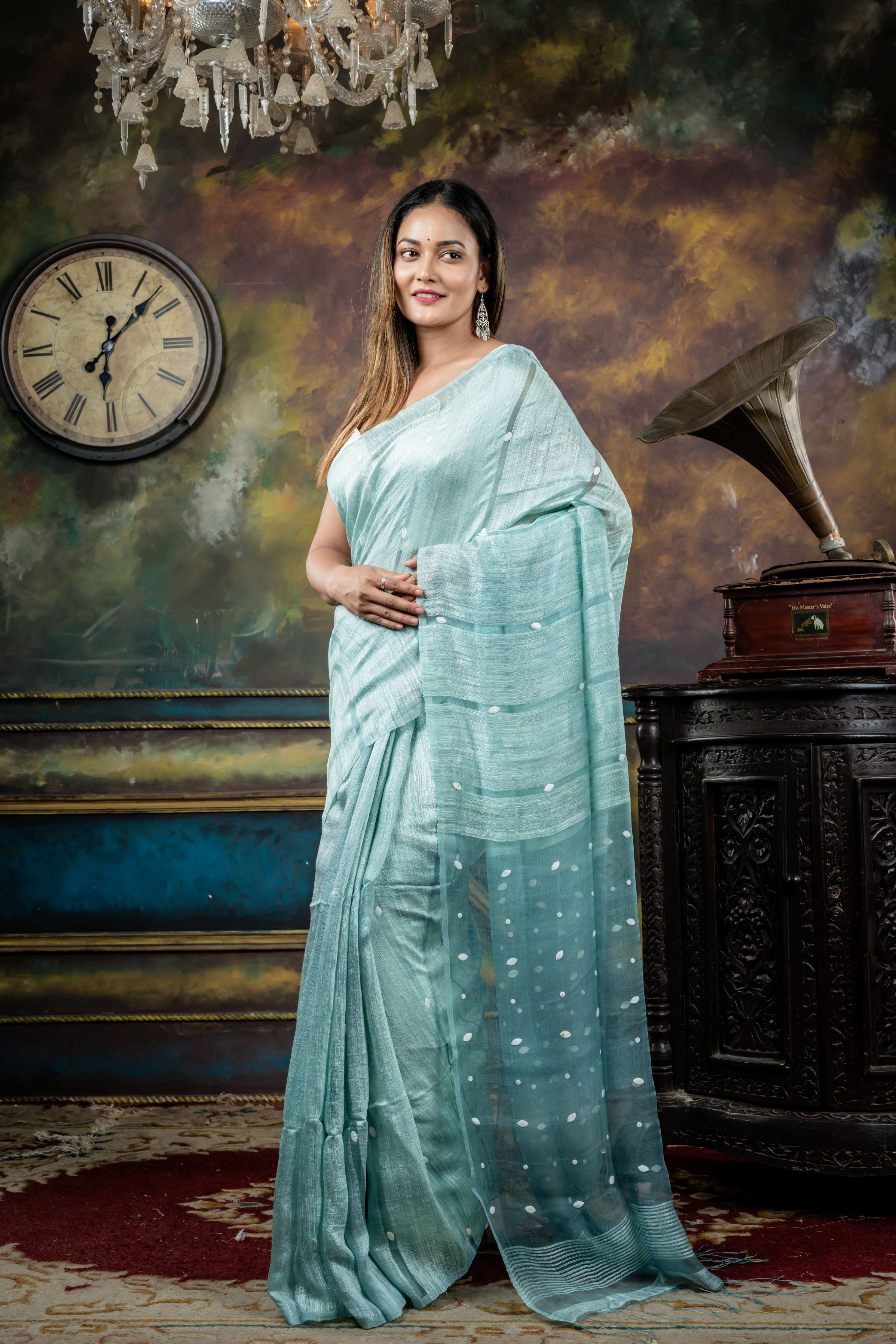 Trishna || Ice Blue Matka Bengal Handloom Saree with Half Body Plain, Half Body woven Sea Shell highlights on Muslin block Stripes and Sea Shell embellished Muslin Pallu
