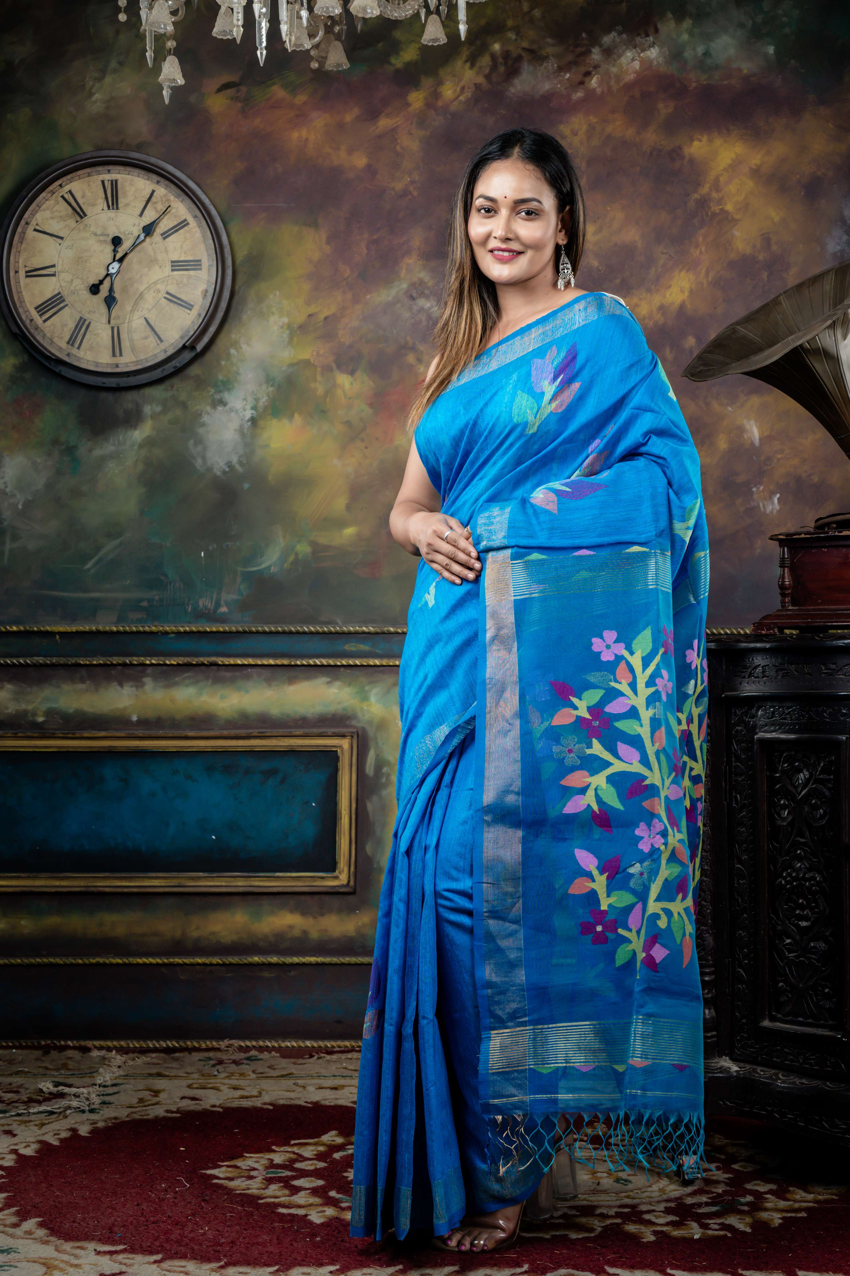 Nila || Cerulean Blue Premium 'Matka-Muslin' Bengal Handloom Saree with all over Multi-colour Floral Jamdani Buta on Matka body & Muslin Pallu with Golden Zari highlights