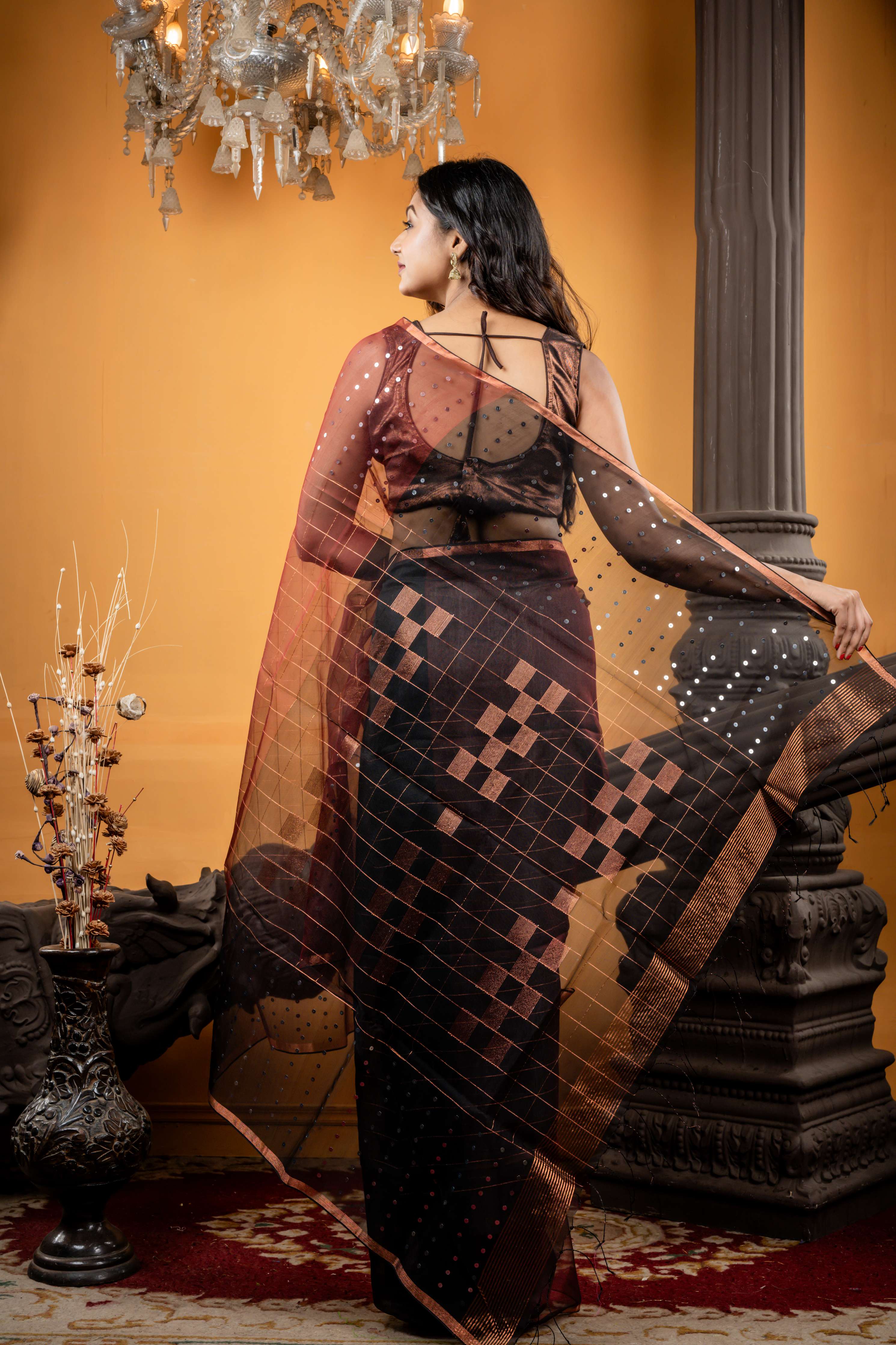 Jhilmil || Rosewood Brown Muslin Bengal Handloom Saree with all over Copper Checks, half body Sequins highlights, half body Plain Black Border and Copper Checks with Sequins highlights Pallu