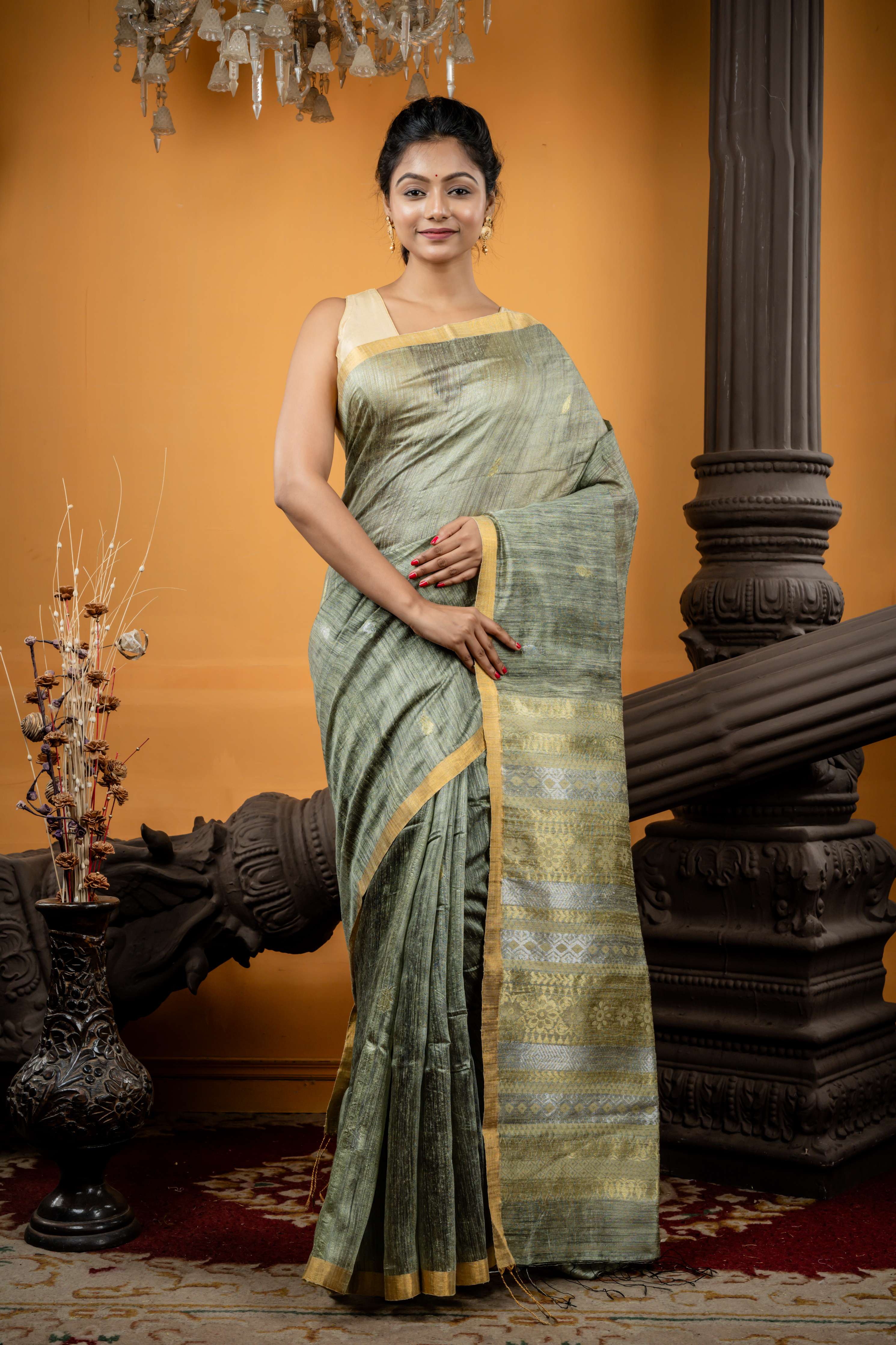 Somlata || Light Sage Green Premium Matka Bengal Handloom Saree with all over 'Sona Rupa' Zari Buta and 'Baluchori' design Stripe Pallu