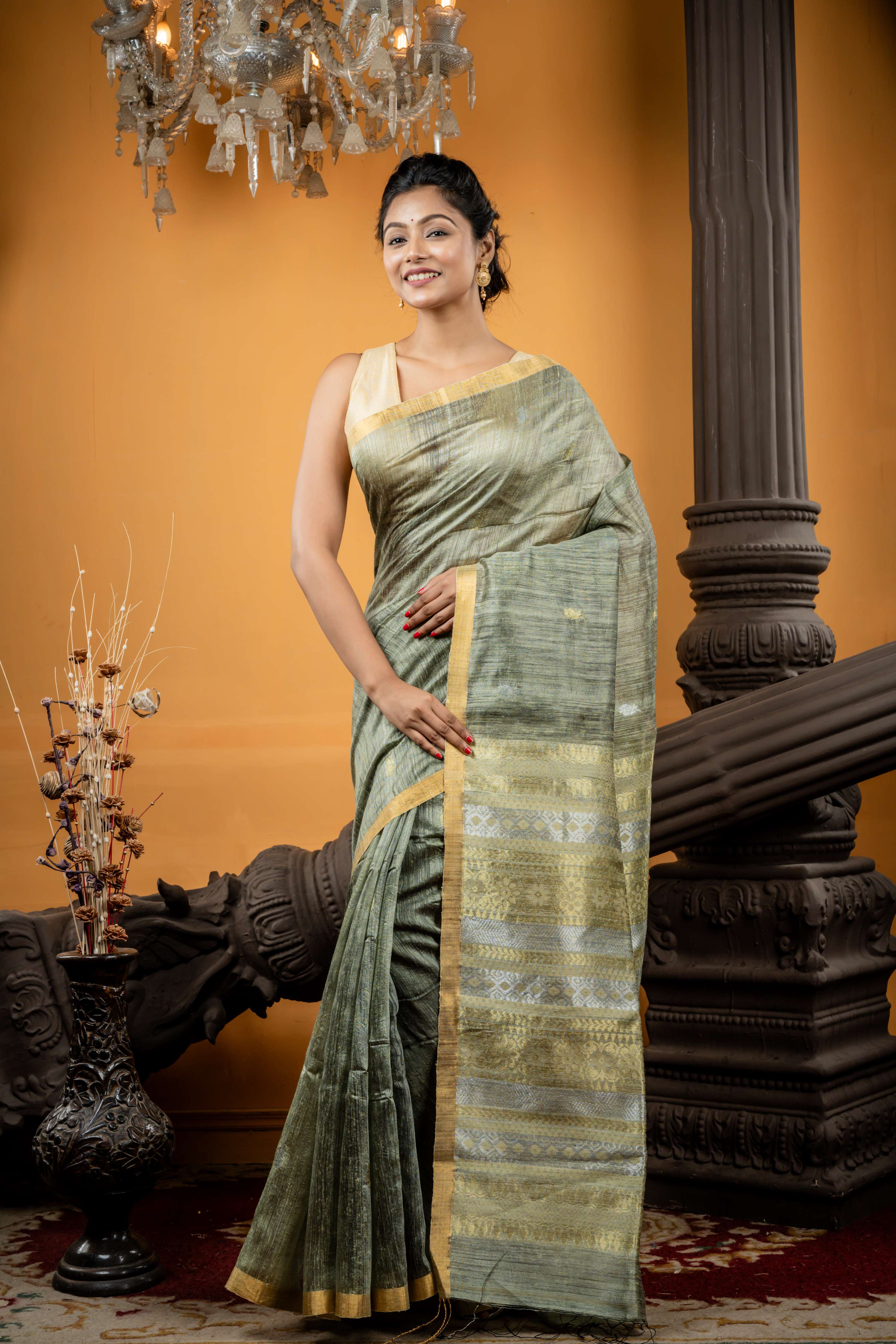 Somlata || Light Sage Green Premium Matka Bengal Handloom Saree with all over 'Sona Rupa' Zari Buta and 'Baluchori' design Stripe Pallu
