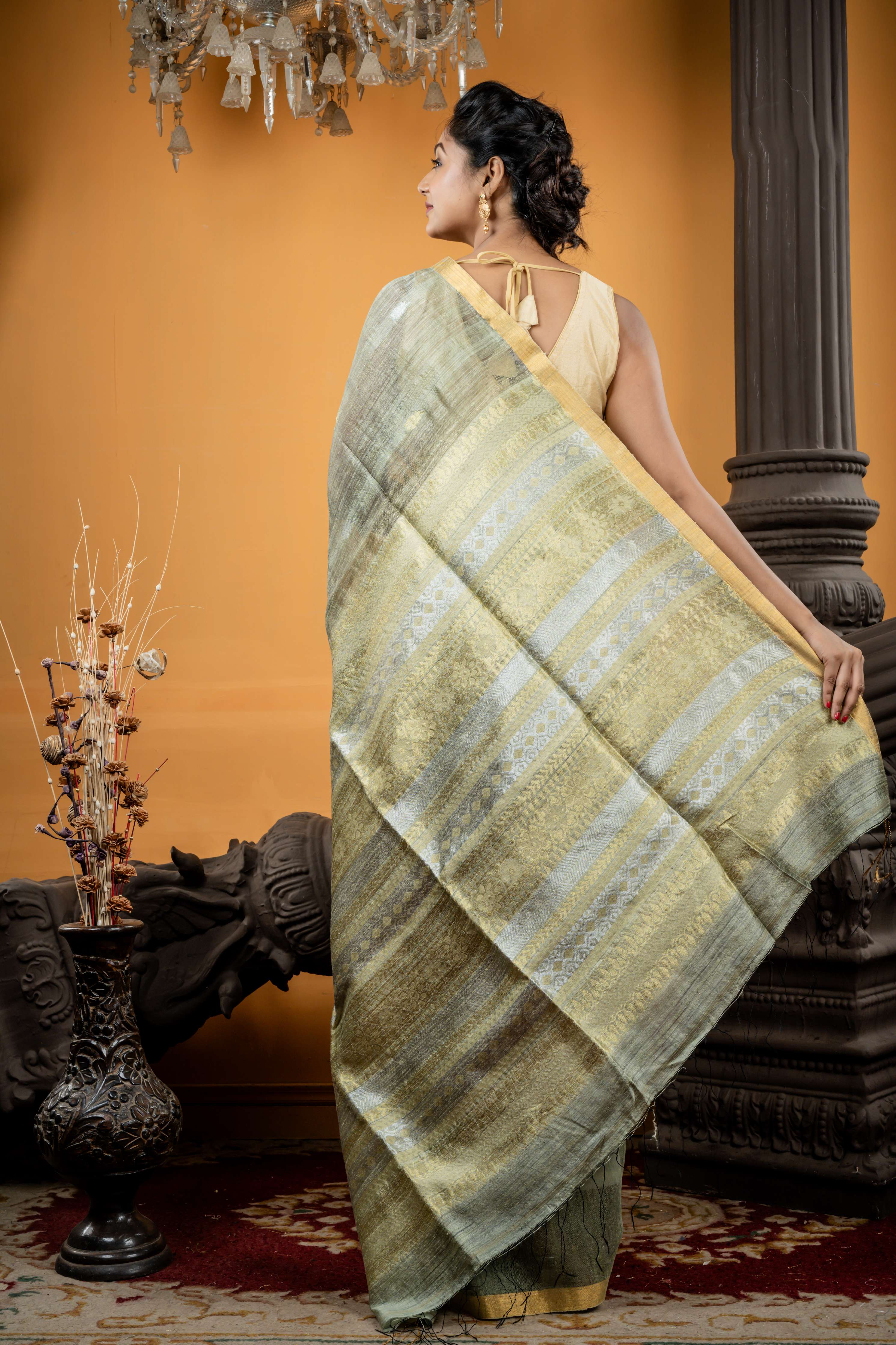 Somlata || Light Sage Green Premium Matka Bengal Handloom Saree with all over 'Sona Rupa' Zari Buta and 'Baluchori' design Stripe Pallu