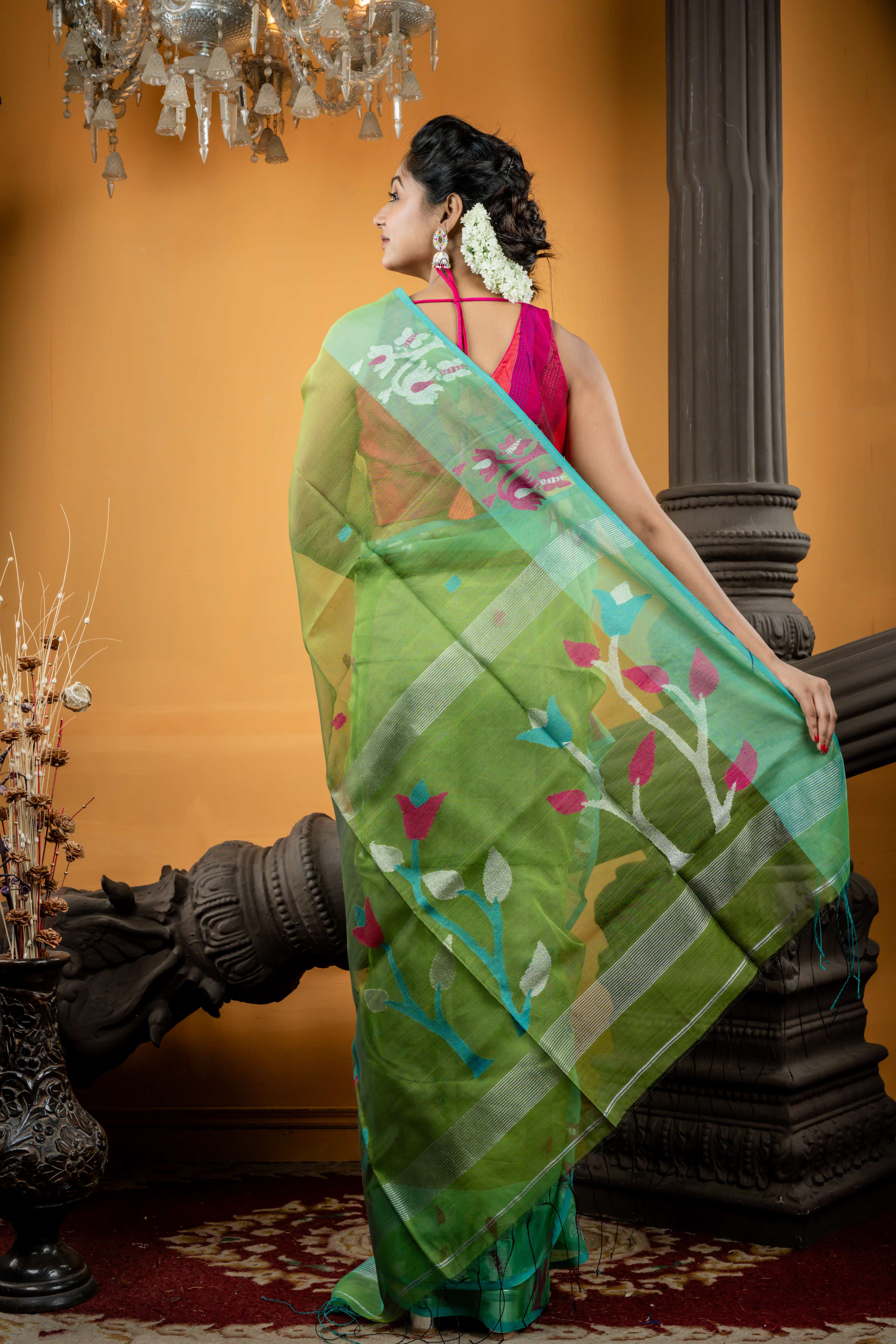 Triparna || Sap Green Premium Muslin Bengal Handloom Saree with all over Multi-colour & Silver Zari Buta and Parrot Green Jamdani Floral motif Border & Pallu