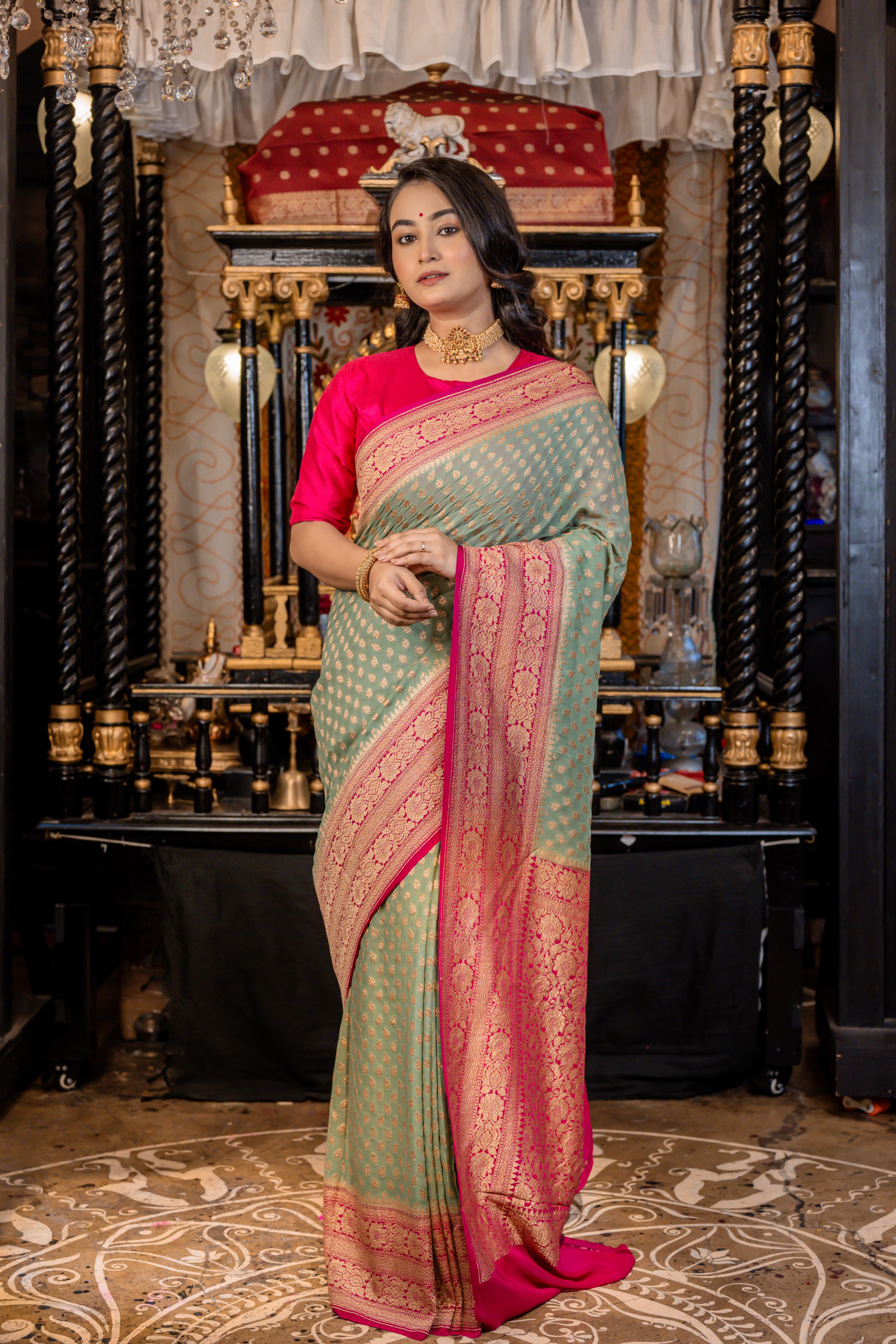Nirvi || Dusty Teal Khaddi Georgette Banarasi Saree with all over Antique Zari Buti and Magenta Pink border