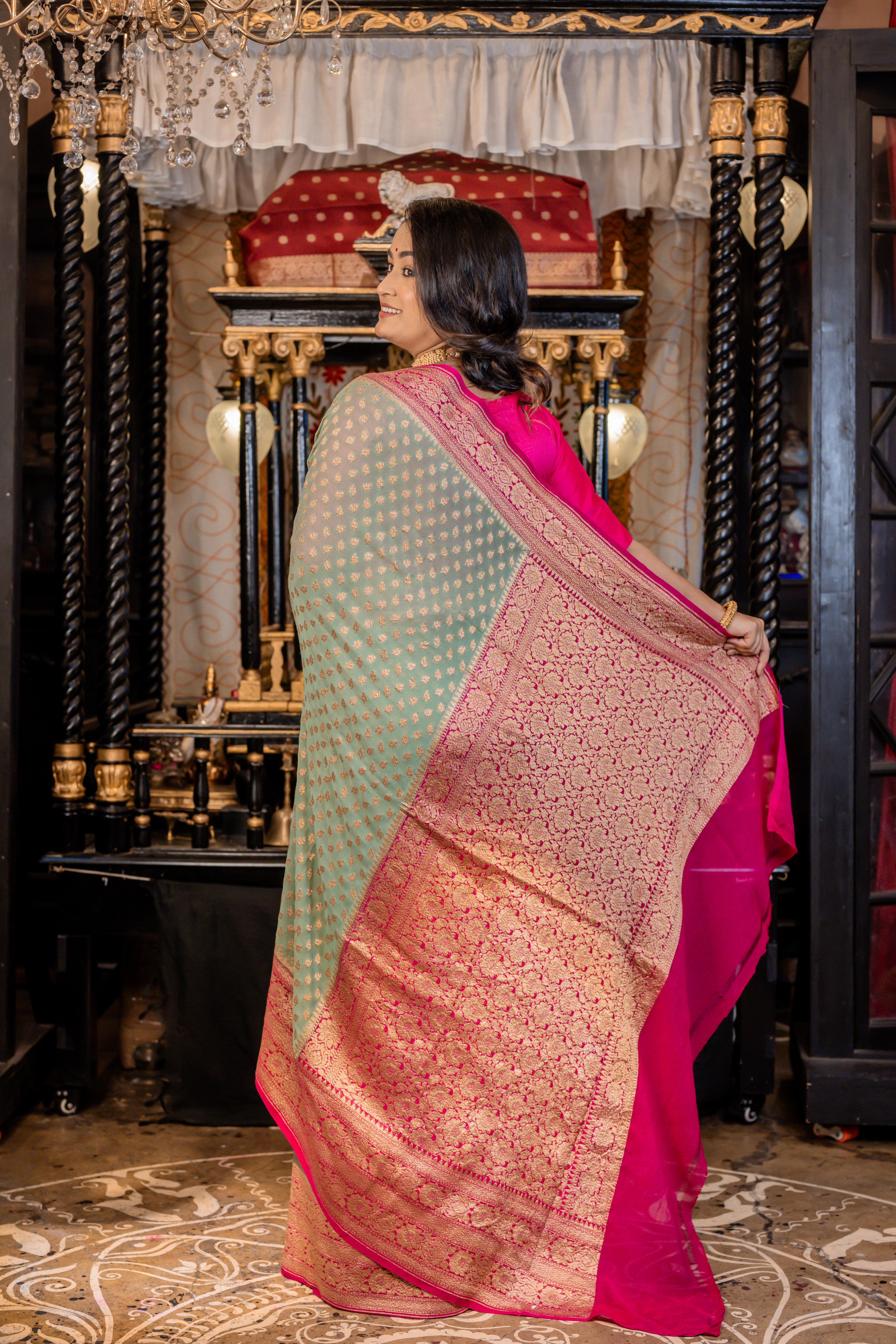 Nirvi || Dusty Teal Khaddi Georgette Banarasi Saree with all over Antique Zari Buti and Magenta Pink border