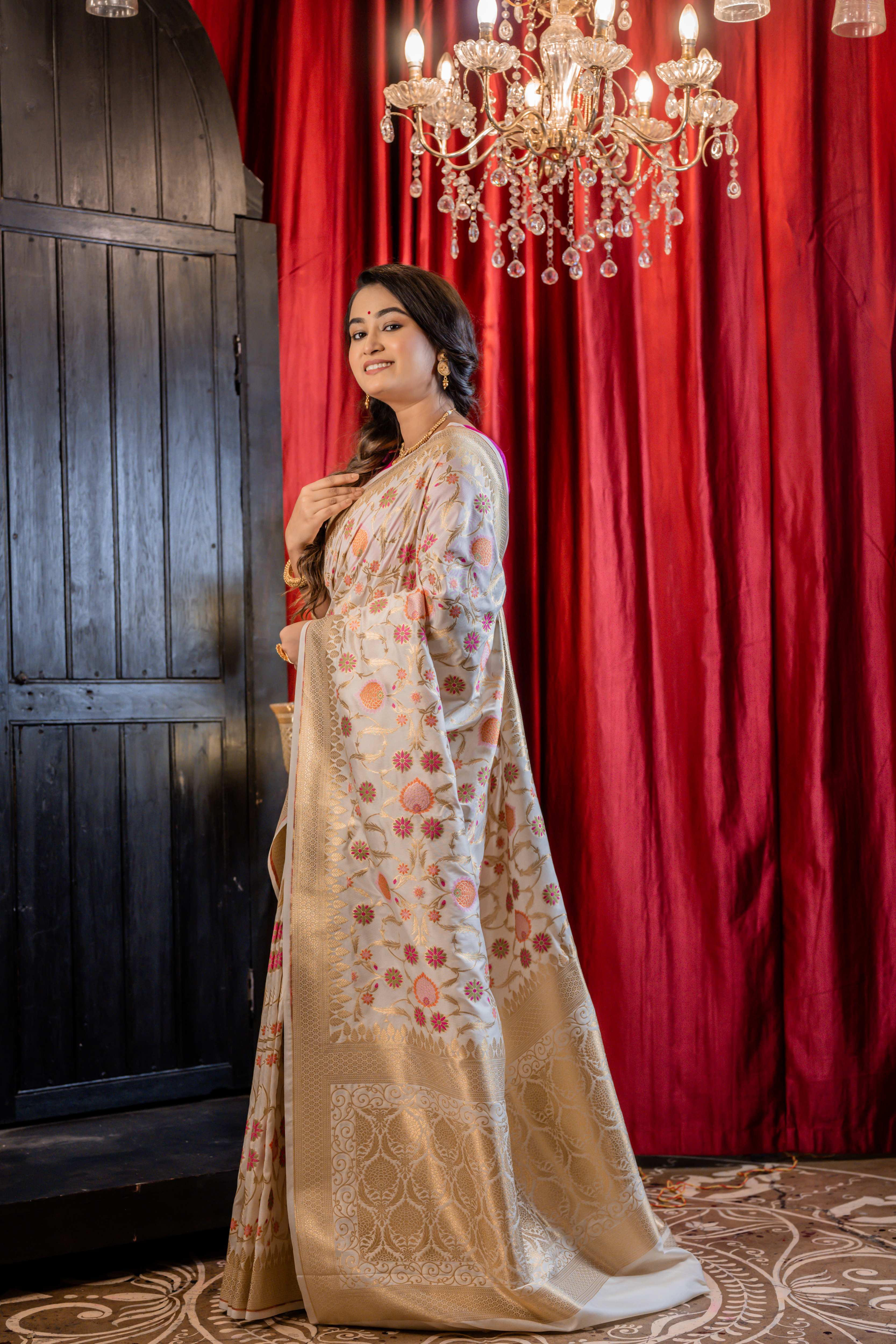 Bahar || Off-White Soft Katan Banarasi Saree with all over multi-colour Floral Jamawar design and Jaal in Golden Zari