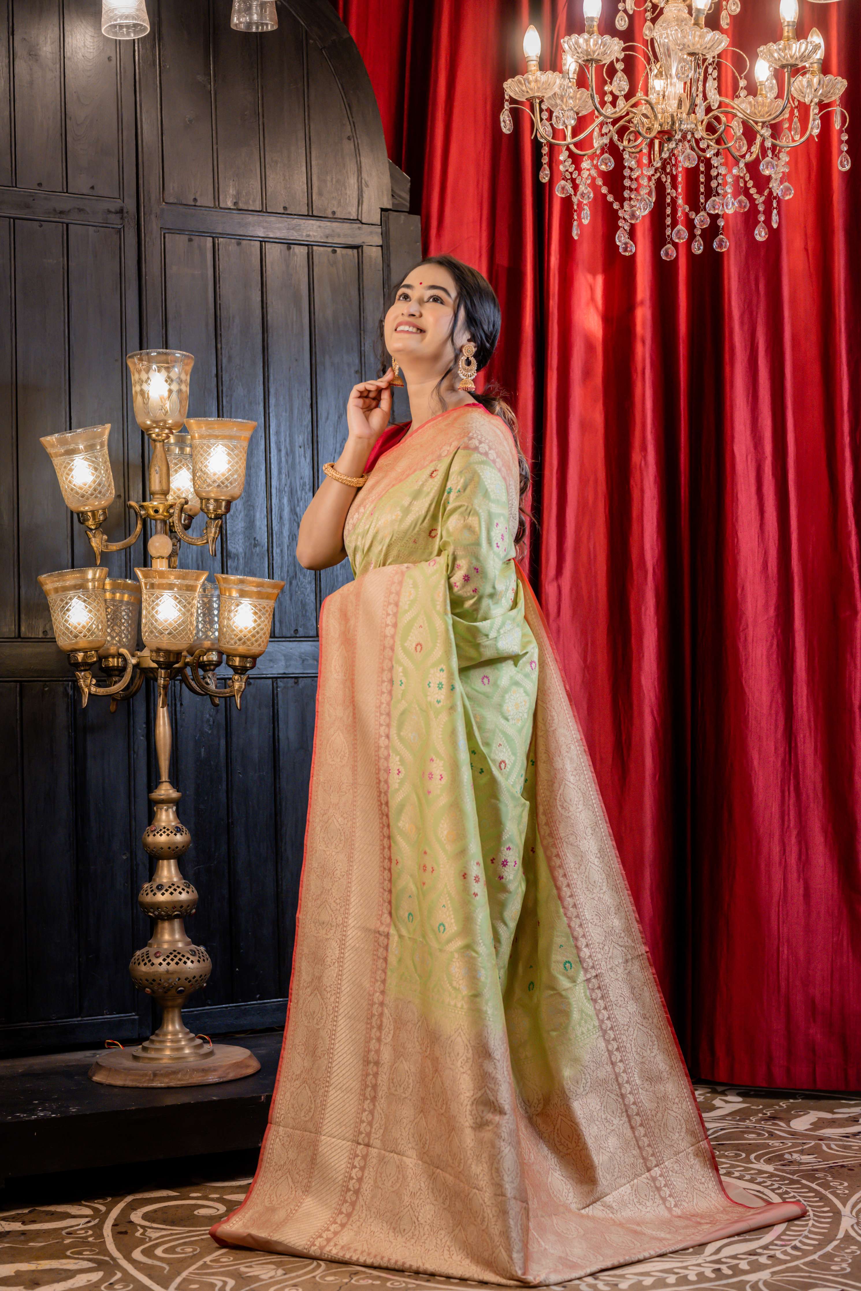 Palashini || Pista Green Matka Silk Banarasi Saree with Multi-colour Meenakari highlights, all over Jaal woven in Matte Gold Zari and Pale Orange border