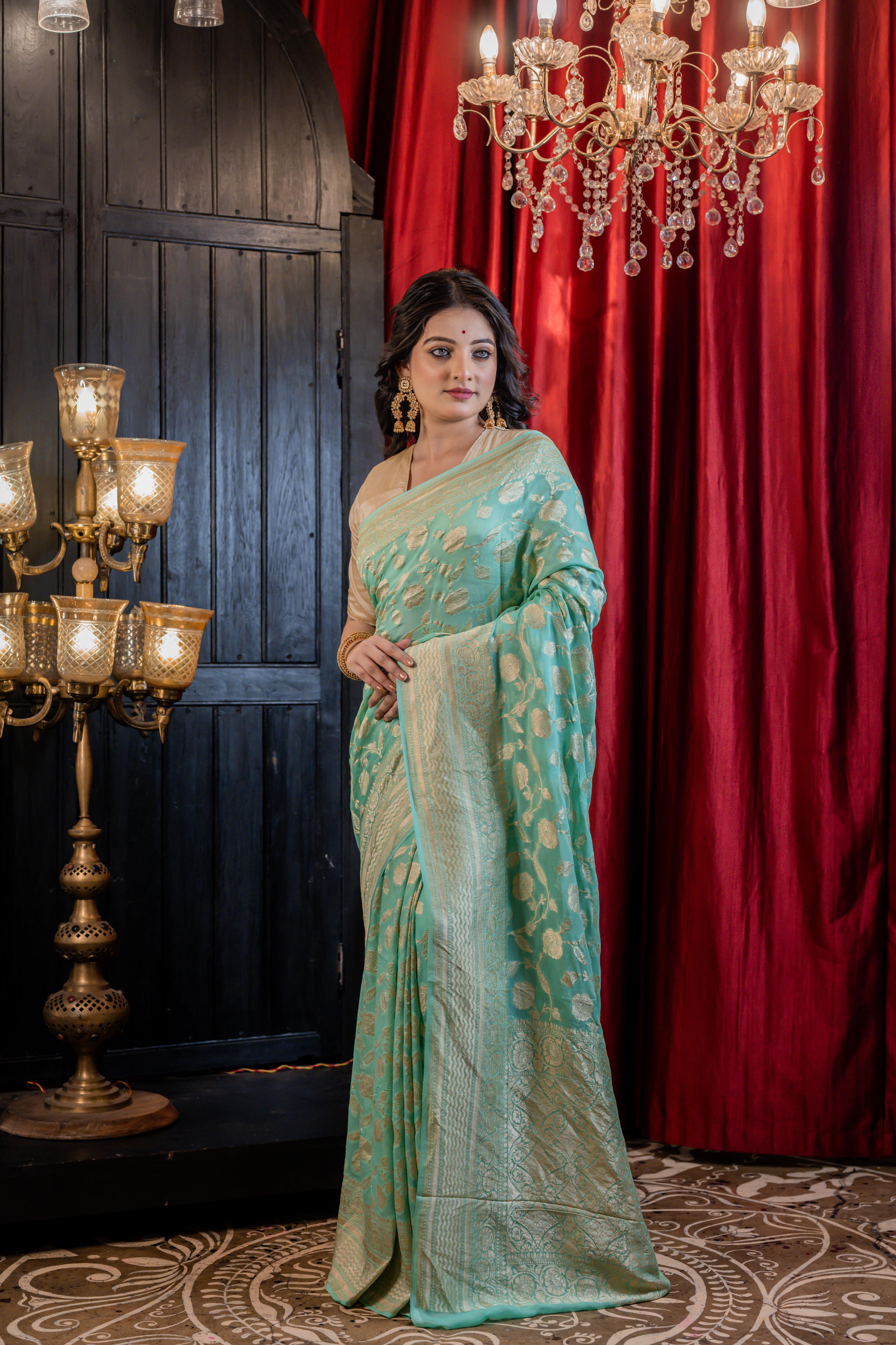 Sagarika || Sea Green Khaddi Georgette Banarasi Saree with all over 'Rose' motif & Jangla in Matte Gold Zari