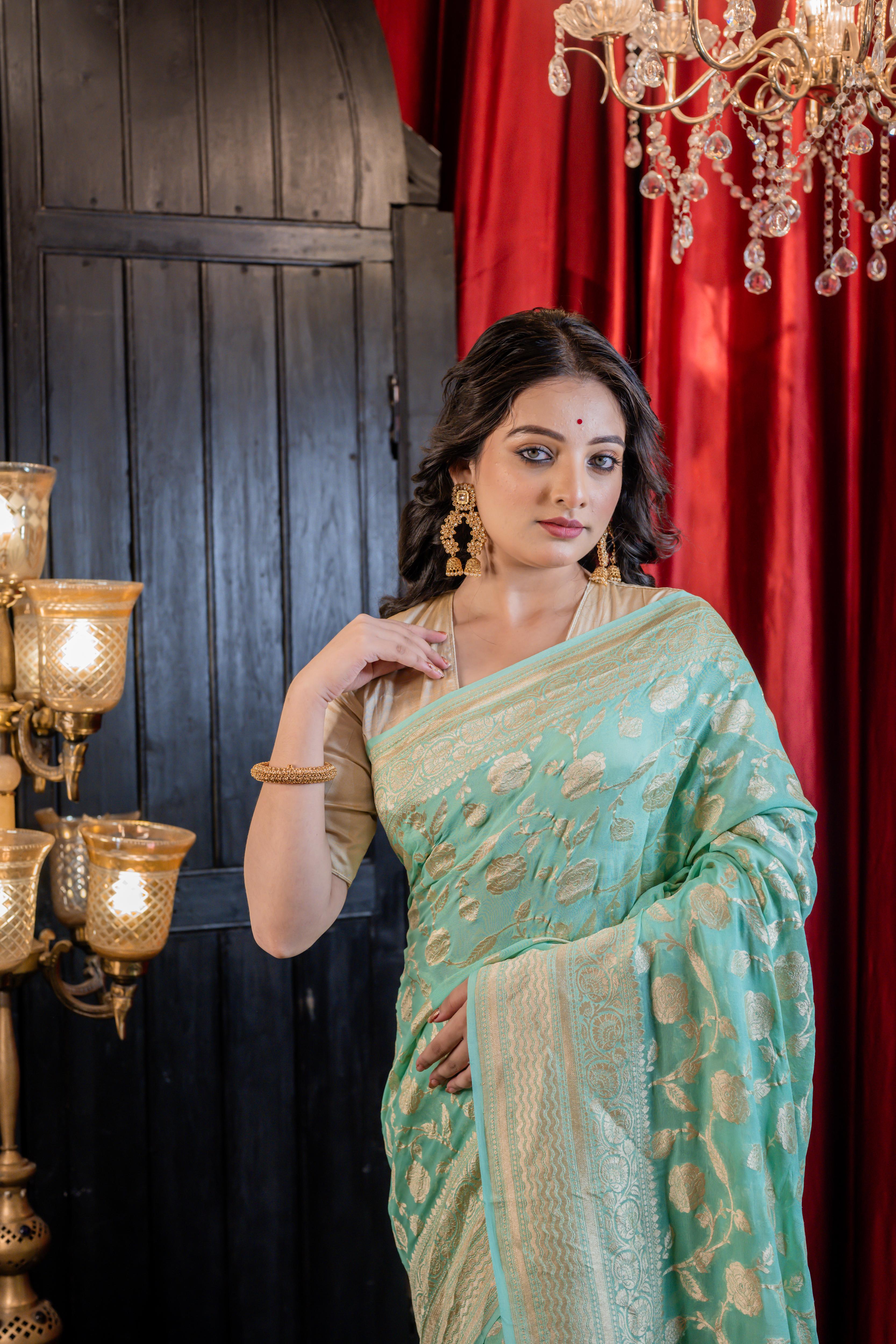 Sagarika || Sea Green Khaddi Georgette Banarasi Saree with all over 'Rose' motif & Jangla in Matte Gold Zari