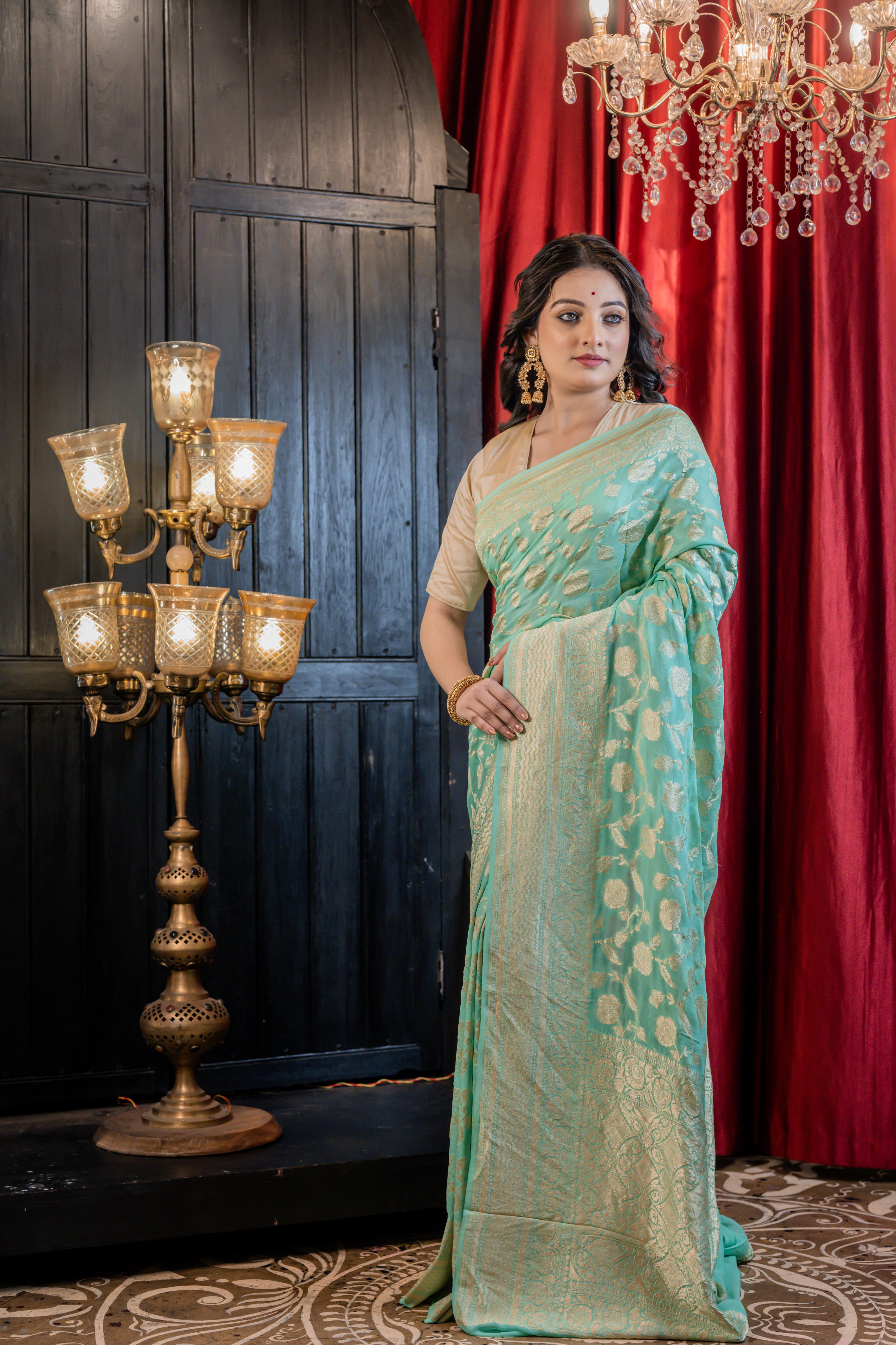 Sagarika || Sea Green Khaddi Georgette Banarasi Saree with all over 'Rose' motif & Jangla in Matte Gold Zari