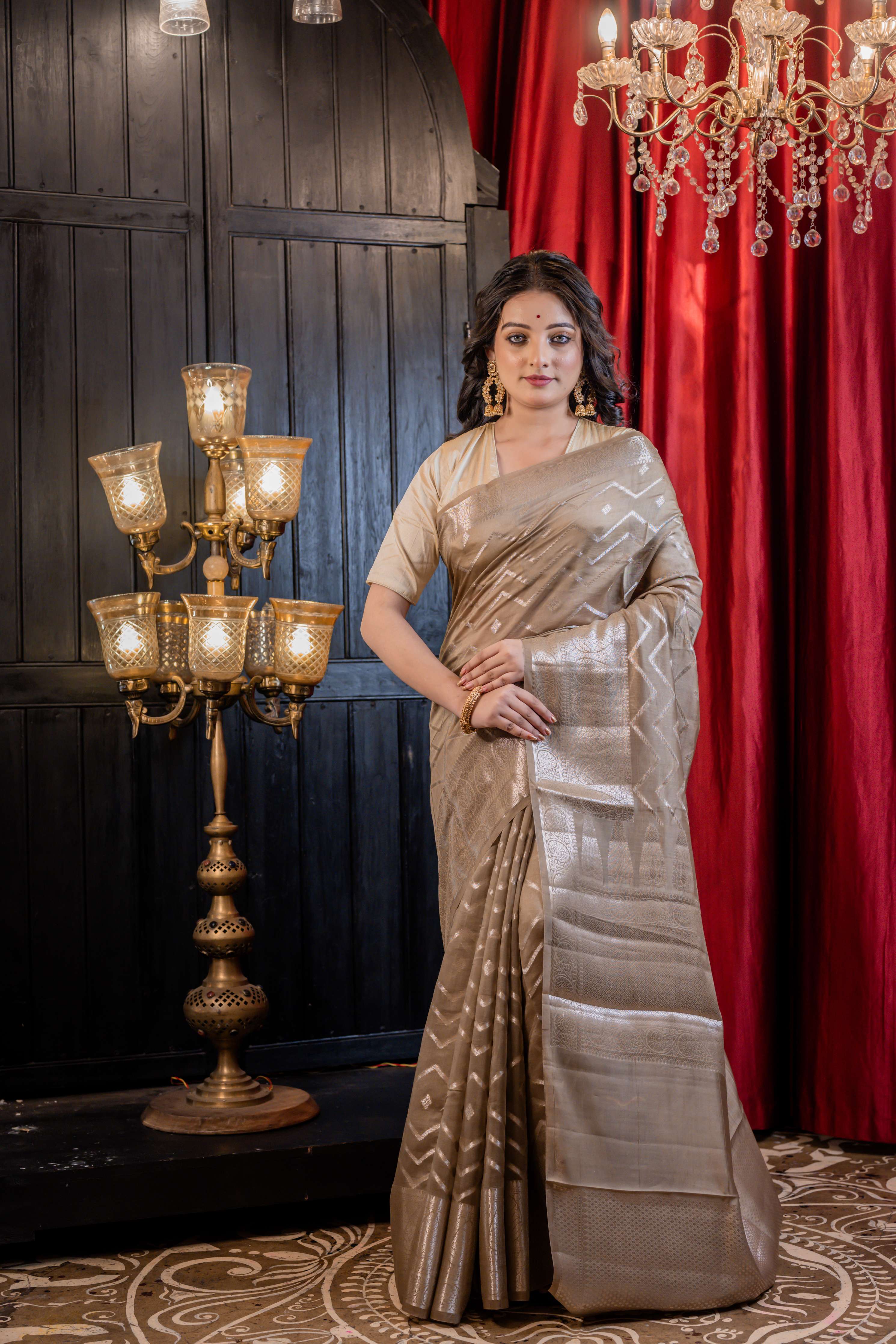 Urmika || Medium Taupe Brown Chinia Silk Banarasi Saree with all over Buta & Stripe Pallu woven in Silver Zari