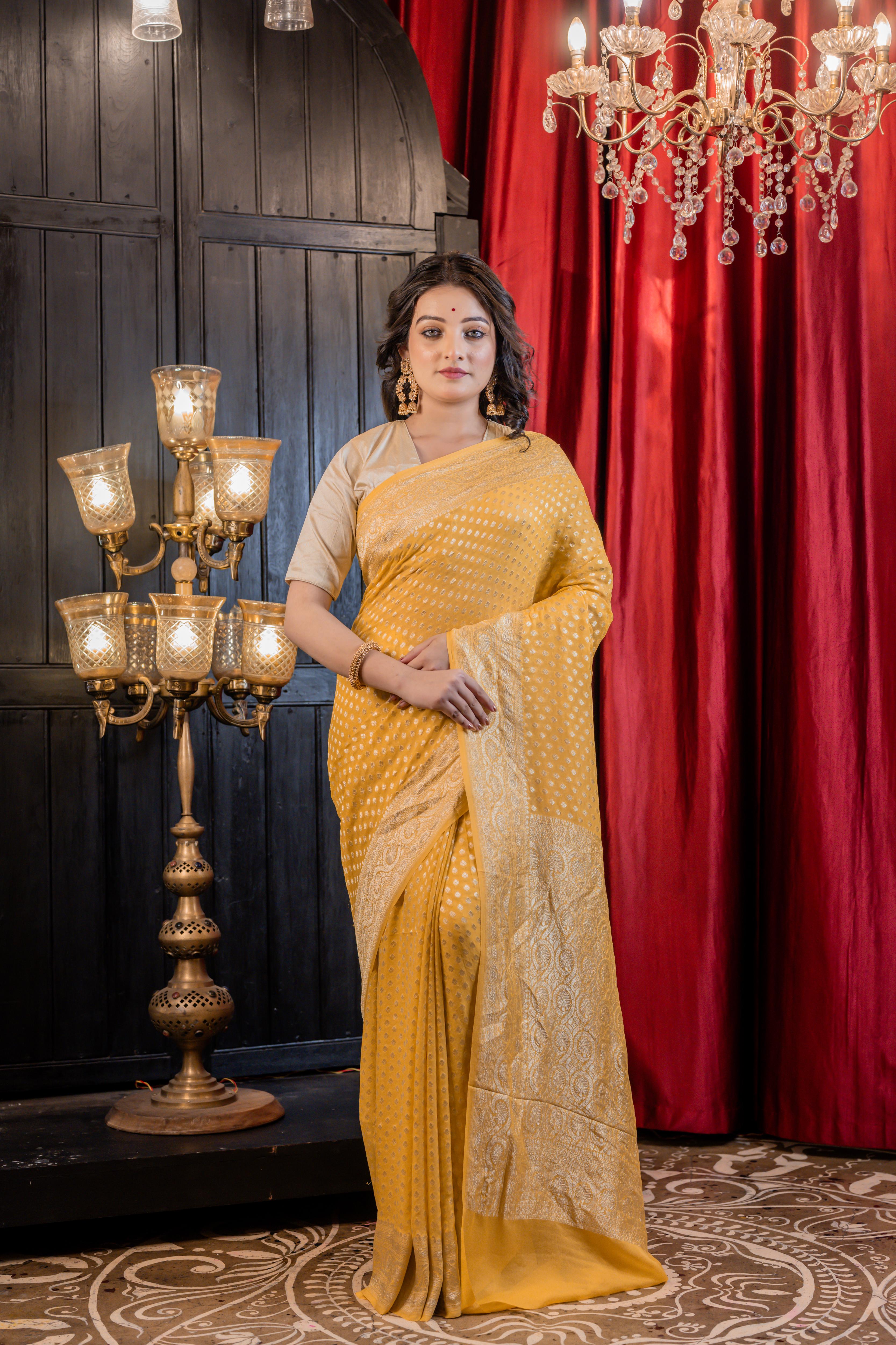 Suravi || Mango Yellow Khaddi Georgette Banarasi Saree with all over Matte Gold Zari Buti