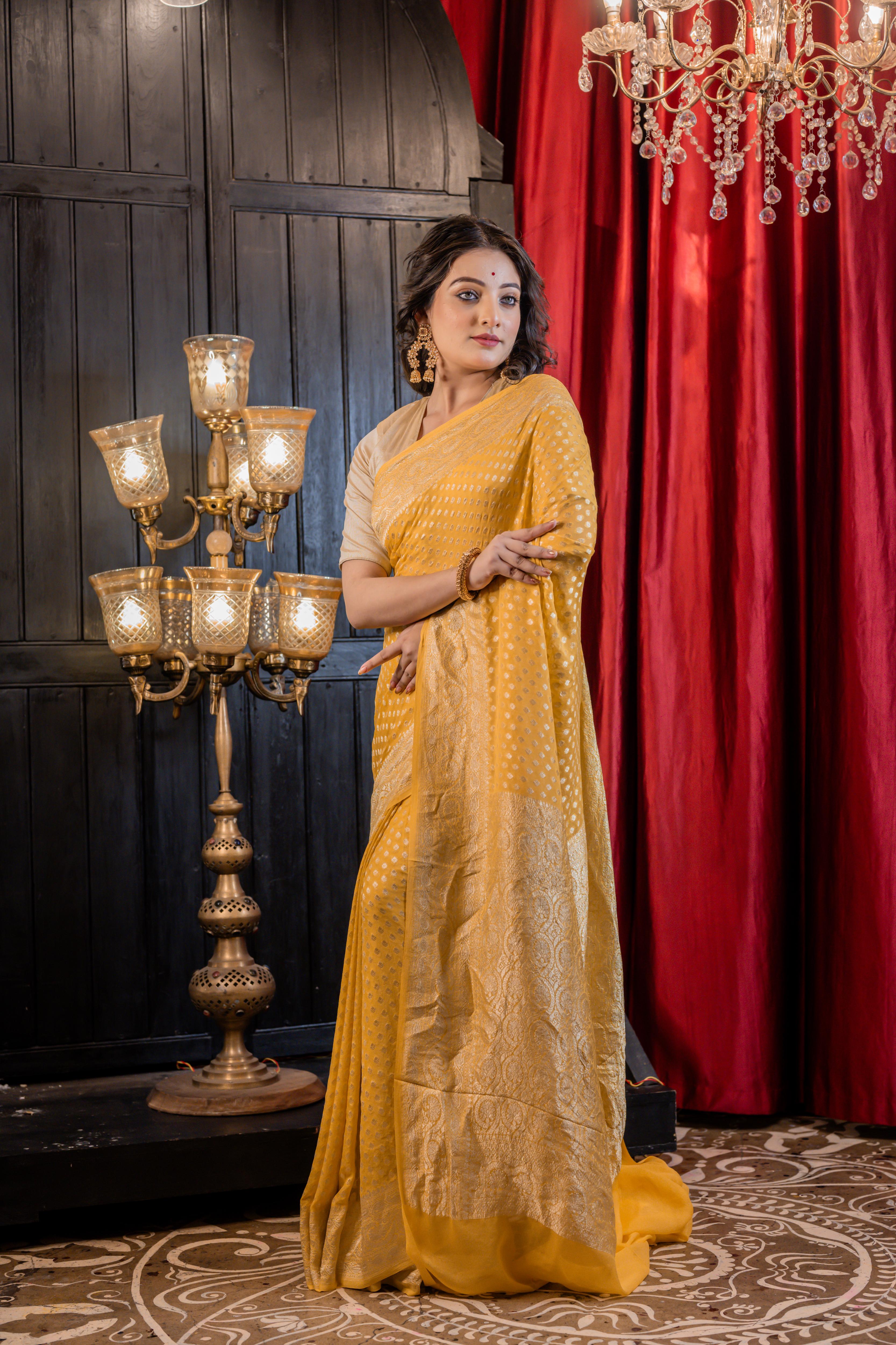 Suravi || Mango Yellow Khaddi Georgette Banarasi Saree with all over Matte Gold Zari Buti