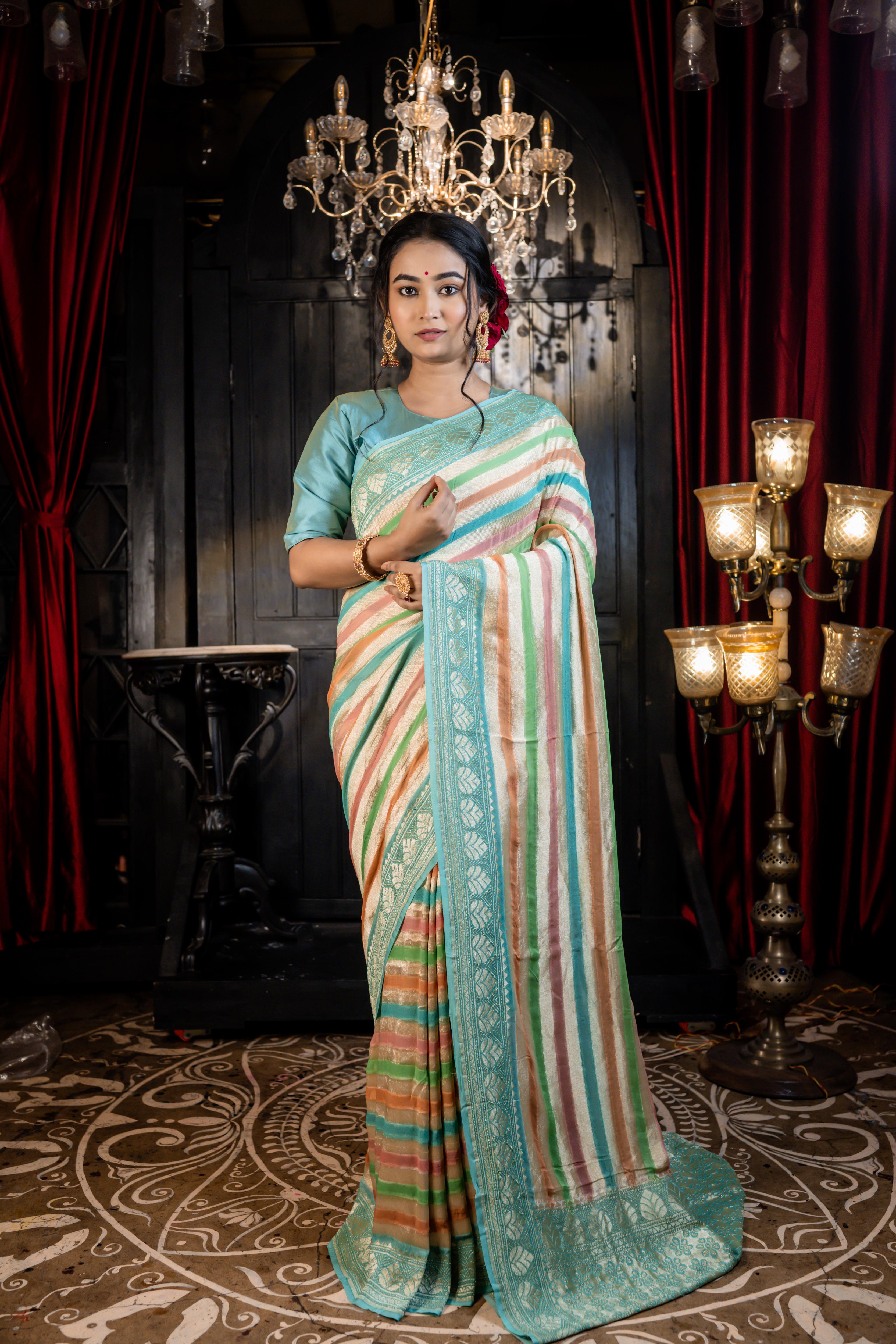 Leheri || All over Rifling Handbrush Multi-coloured & Matte Gold Zari woven Stripes Khaddi Georgette Banarasi Saree with Sky Blue & Matte Gold Zari border