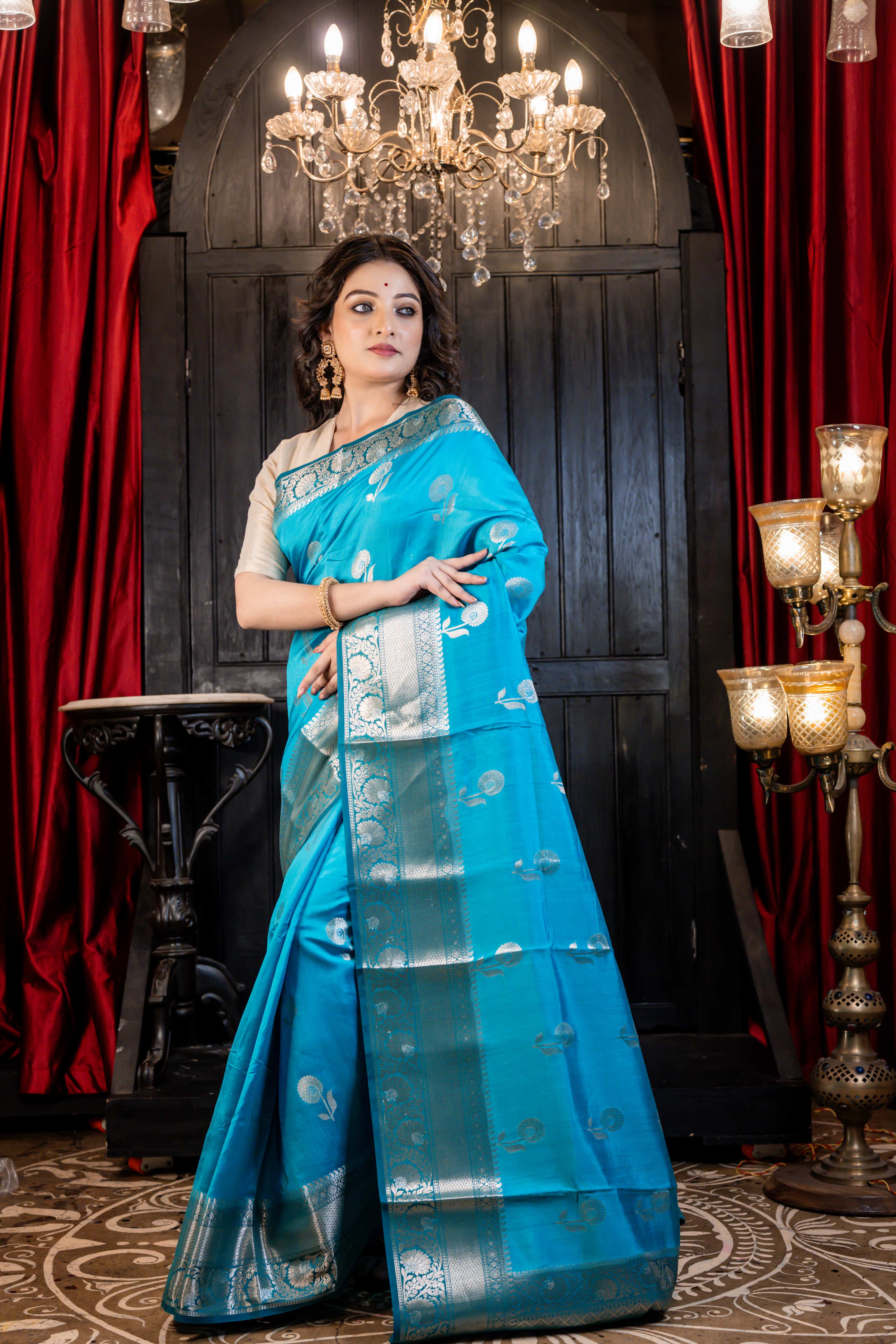 Arnavi || Turquoise Blue Pure Munga Handloom Banarasi Saree with all over 'Sona Rupa' Floral Buta and Border