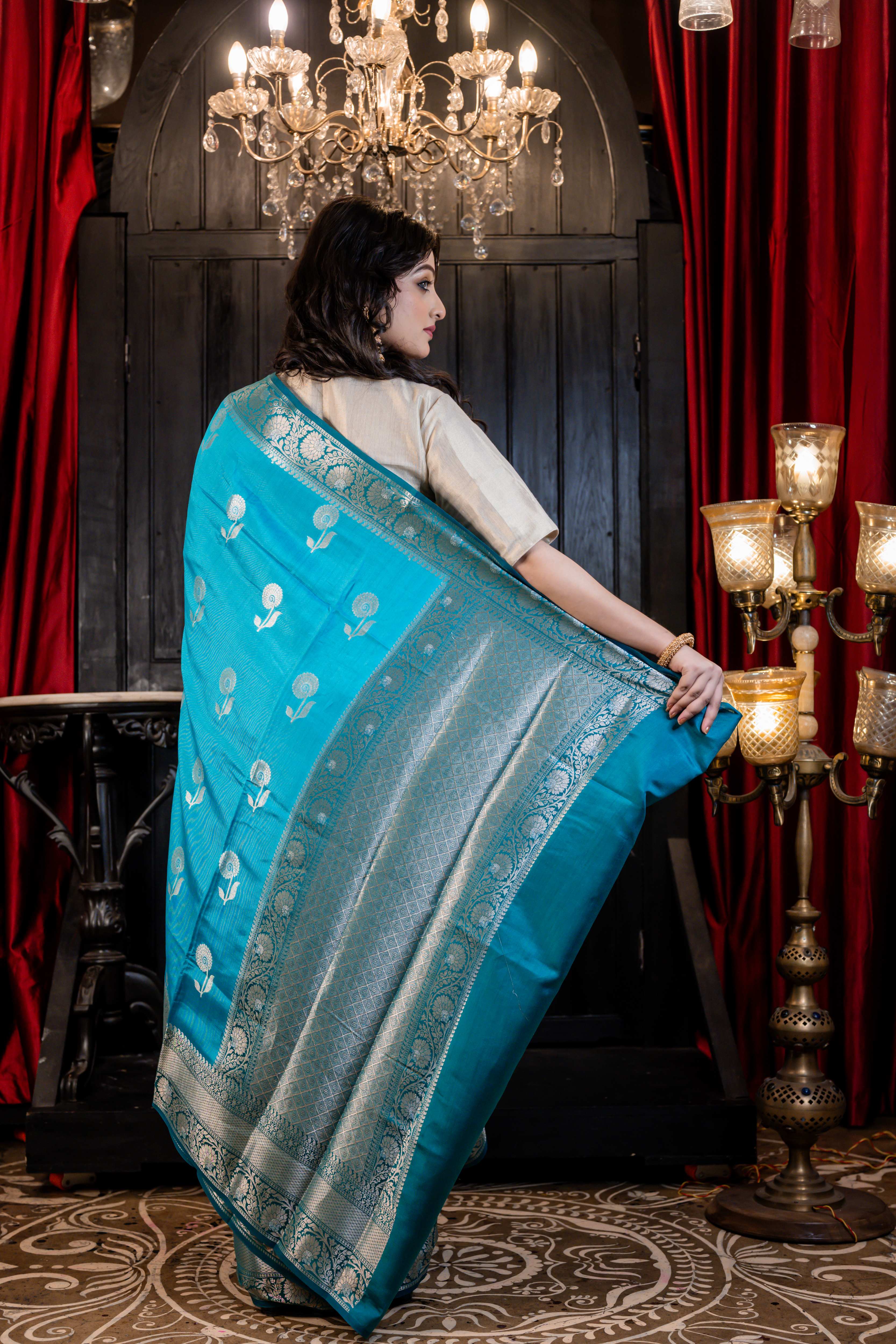 Arnavi || Turquoise Blue Pure Munga Handloom Banarasi Saree with all over 'Sona Rupa' Floral Buta and Border