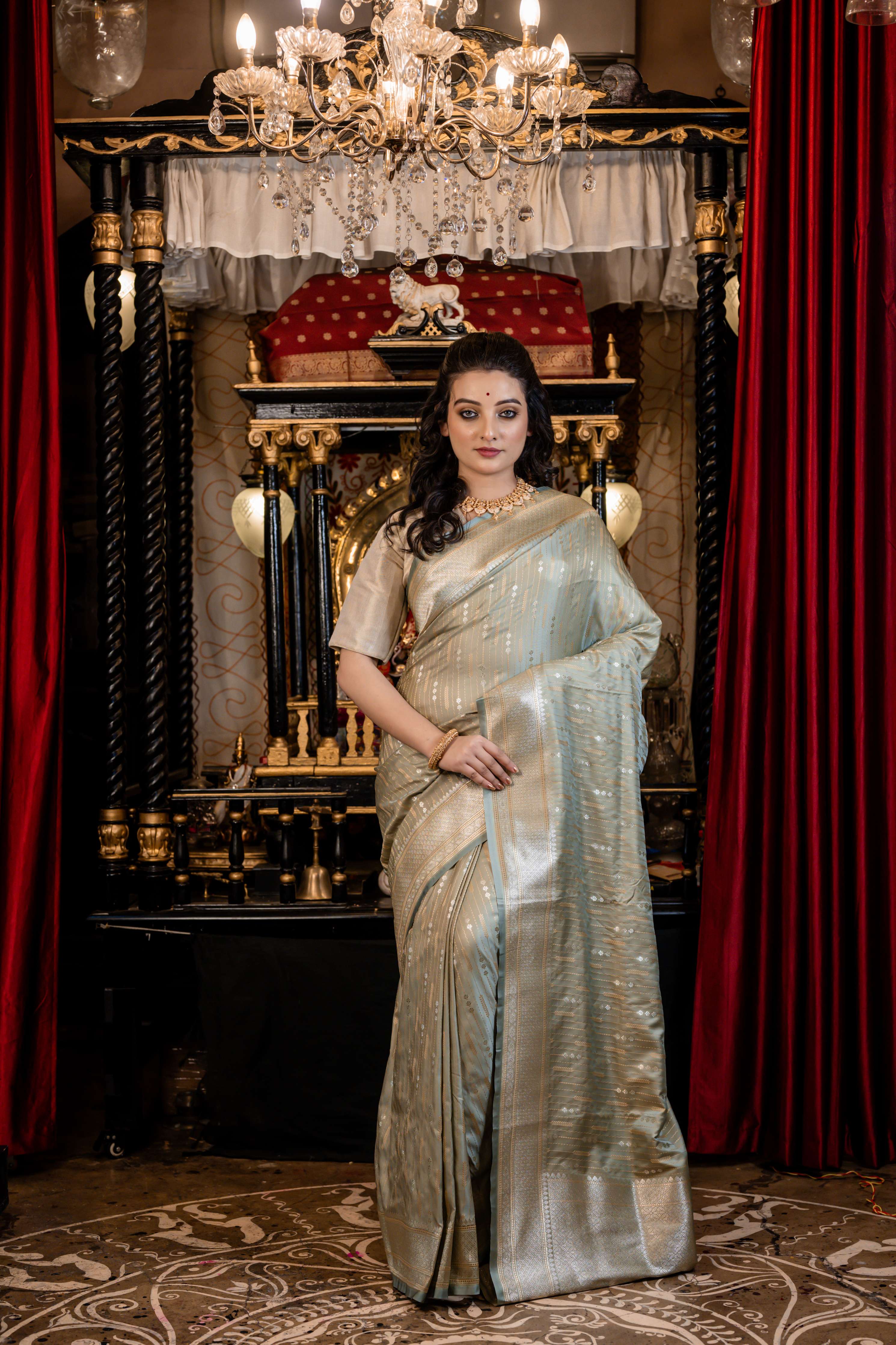 Lavina || Light Sage Green Mashru Silk Banarasi Saree with all over Buta and Stripes in Silver Zari
