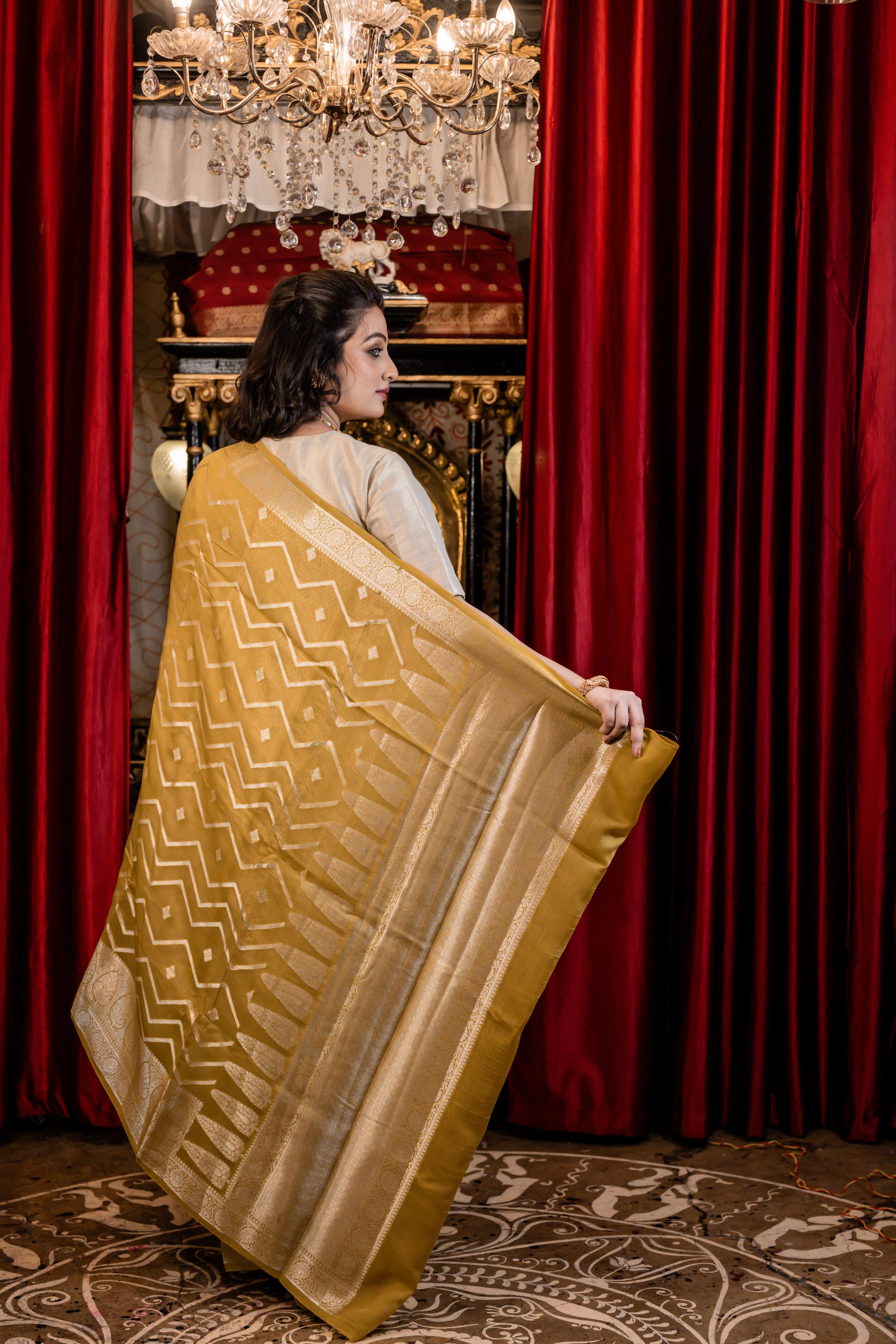 Laya || Olive Green Chinia Silk Banarasi Saree with all over Buta & Zigzag Stripe woven in Silver Zari