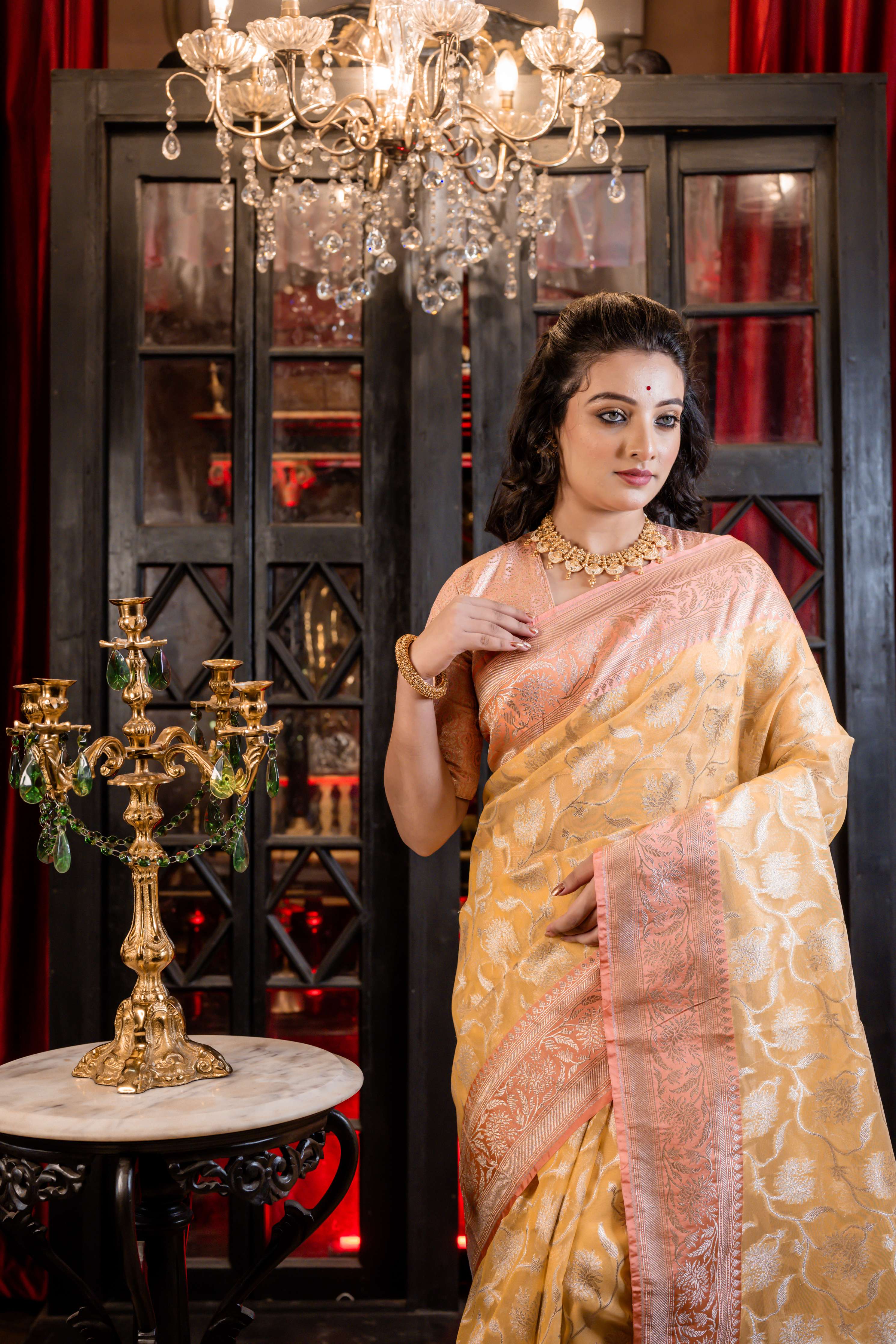 Hyma || Mango Yellow Organza Banarasi Saree with all over Matte Gold Zari Floral Jaal and Coral Pink Border