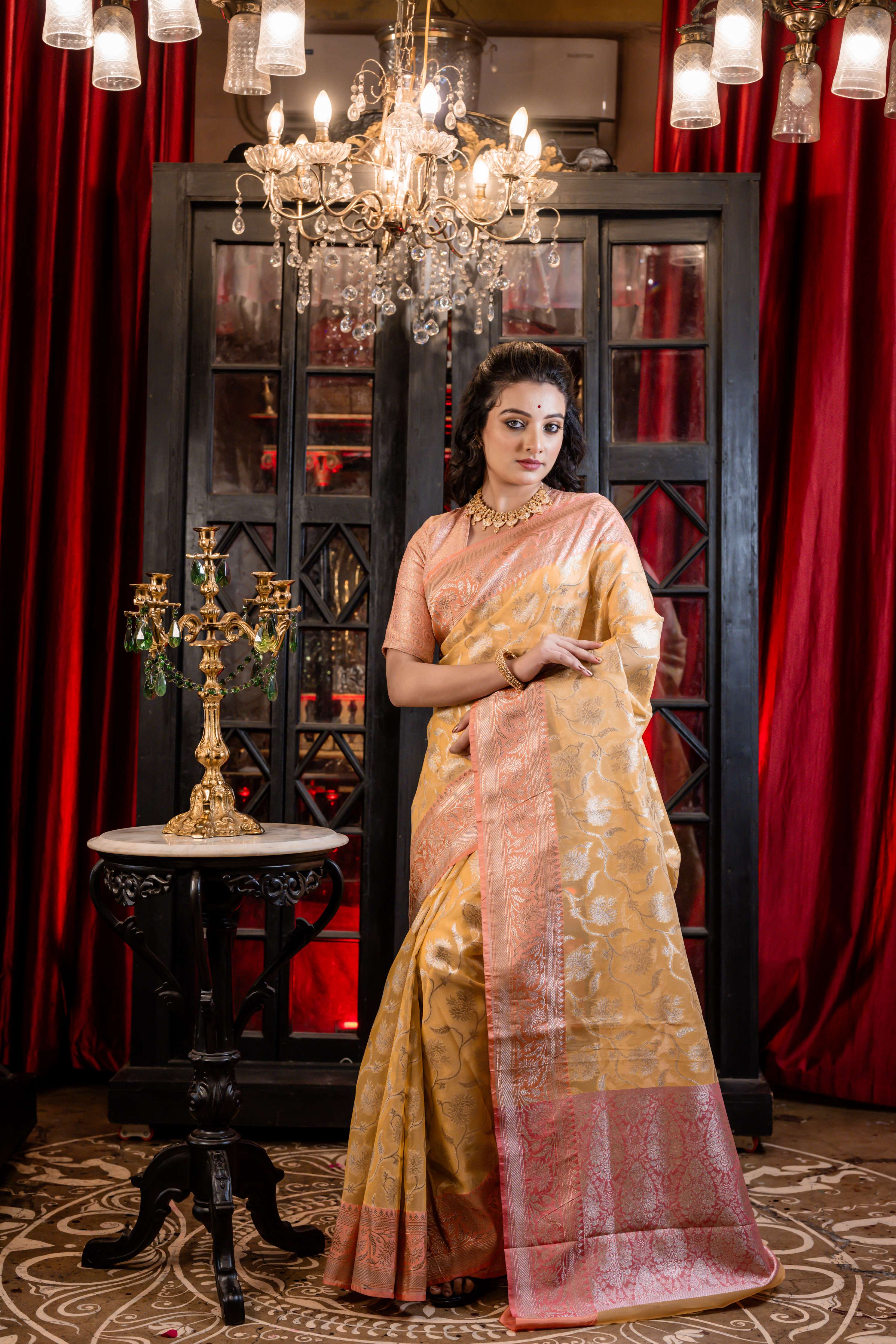 Hyma || Mango Yellow Organza Banarasi Saree with all over Matte Gold Zari Floral Jaal and Coral Pink Border