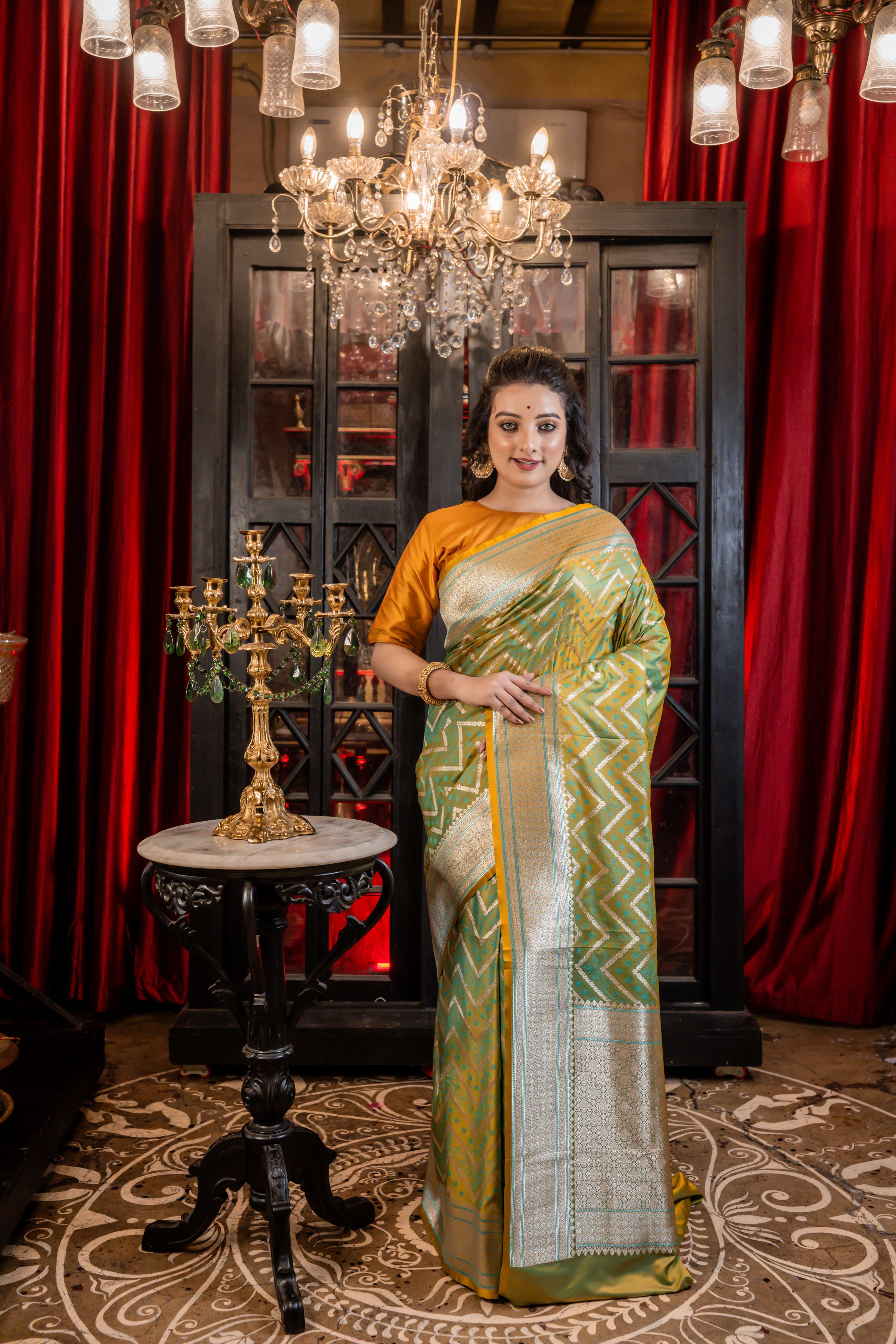 Dhruva || Metallic Teal Green & Mustard Yellow dual-tone Mashru Silk Banarasi Saree with all over Resham Buta and Silver Zari Zigzag Stripes