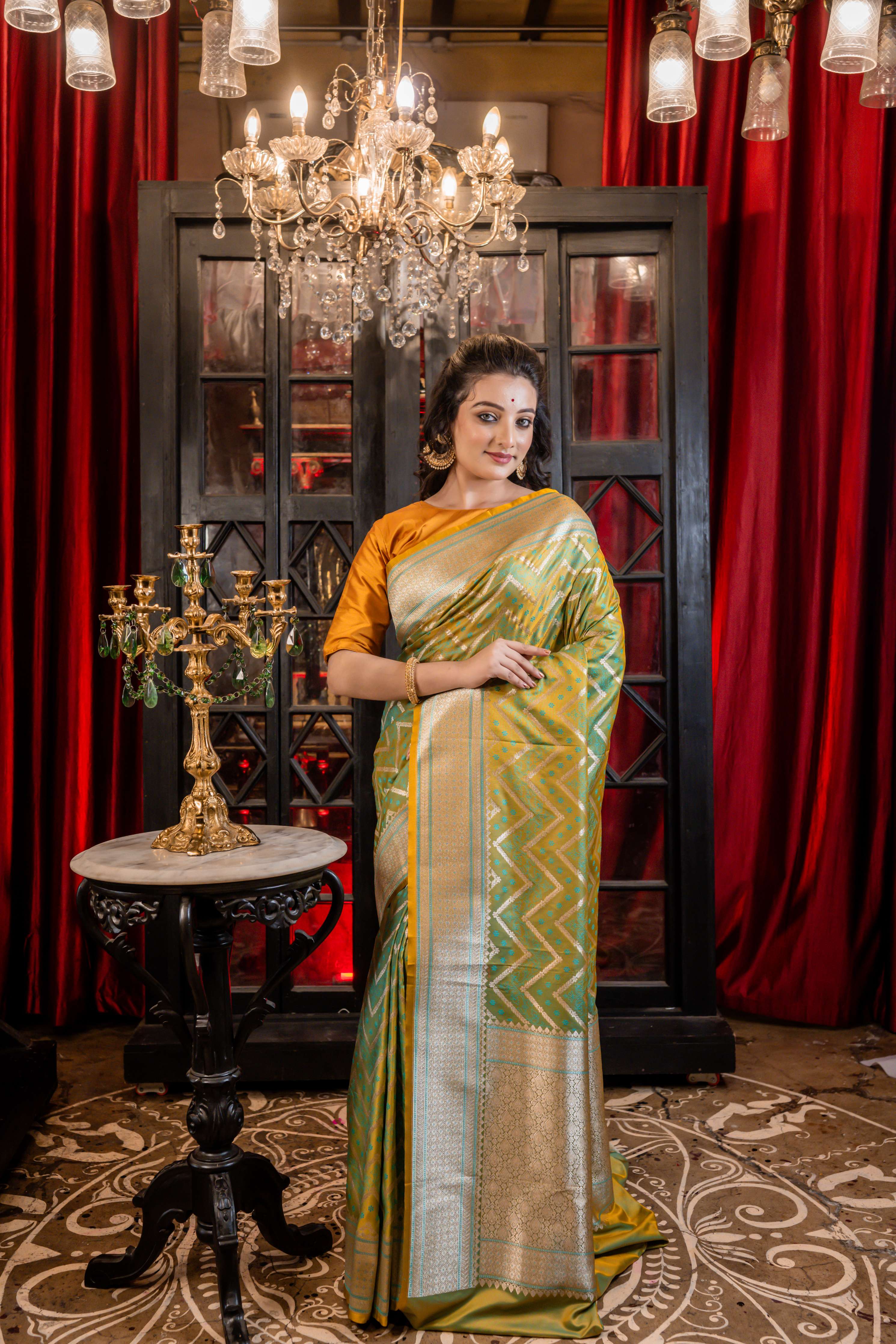 Dhruva || Metallic Teal Green & Mustard Yellow dual-tone Mashru Silk Banarasi Saree with all over Resham Buta and Silver Zari Zigzag Stripes