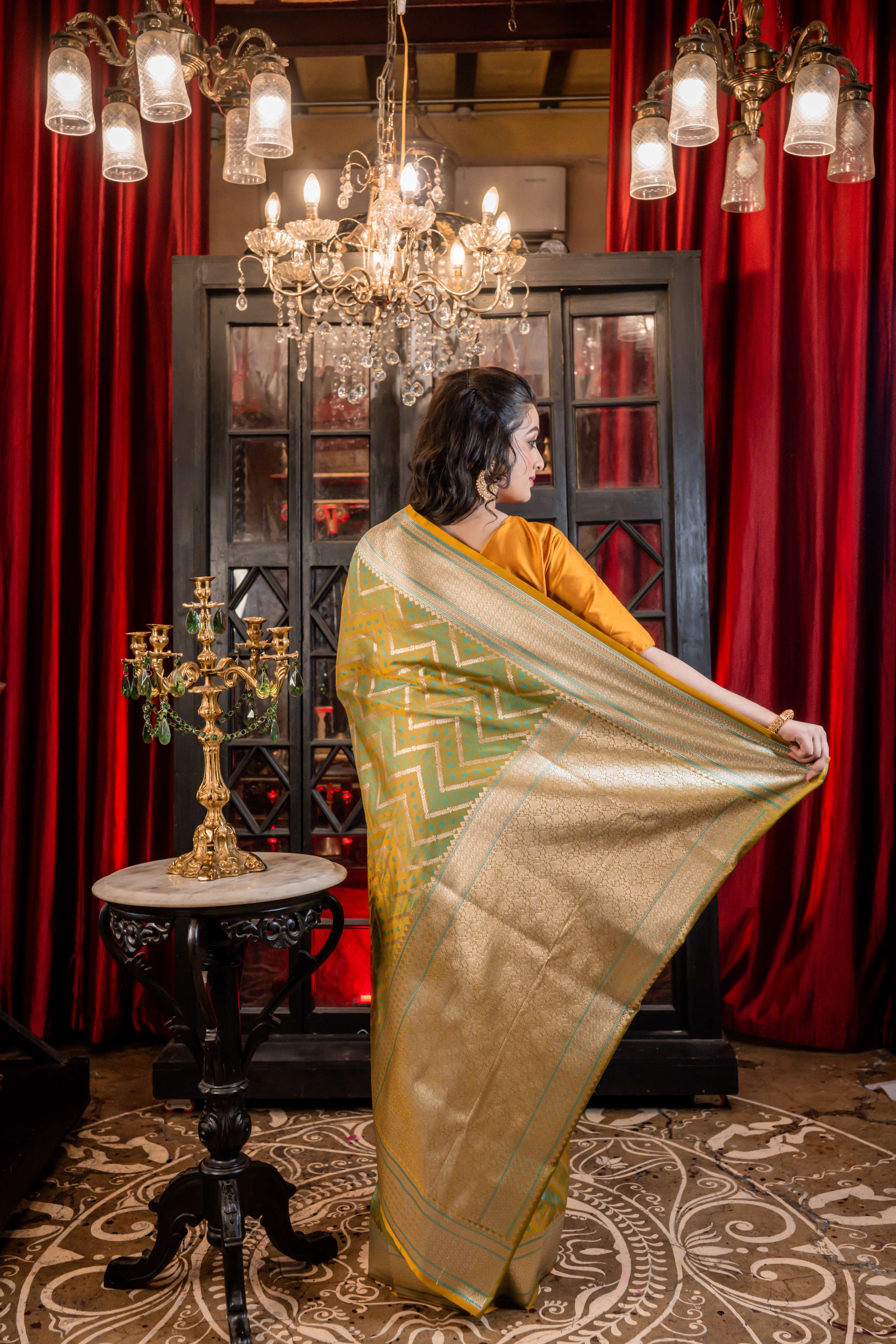 Dhruva || Metallic Teal Green & Mustard Yellow dual-tone Mashru Silk Banarasi Saree with all over Resham Buta and Silver Zari Zigzag Stripes