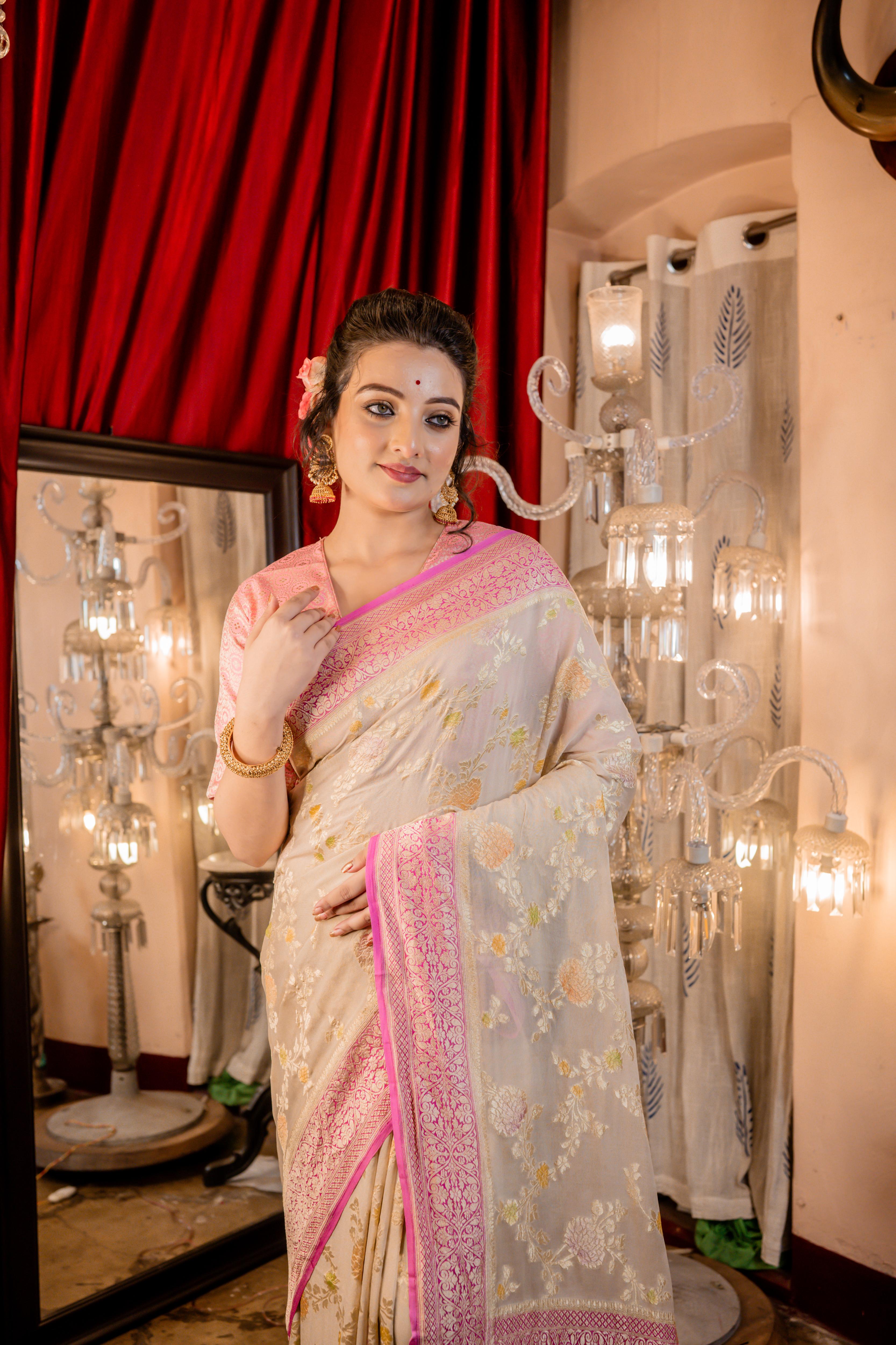 Barkha || Oyster Grey Khaddi Georgette Banarasi Saree with all over Rifling Handbrush Multi-colour & Matte Gold Zari Floral motif Jangla and Lilac Pink border