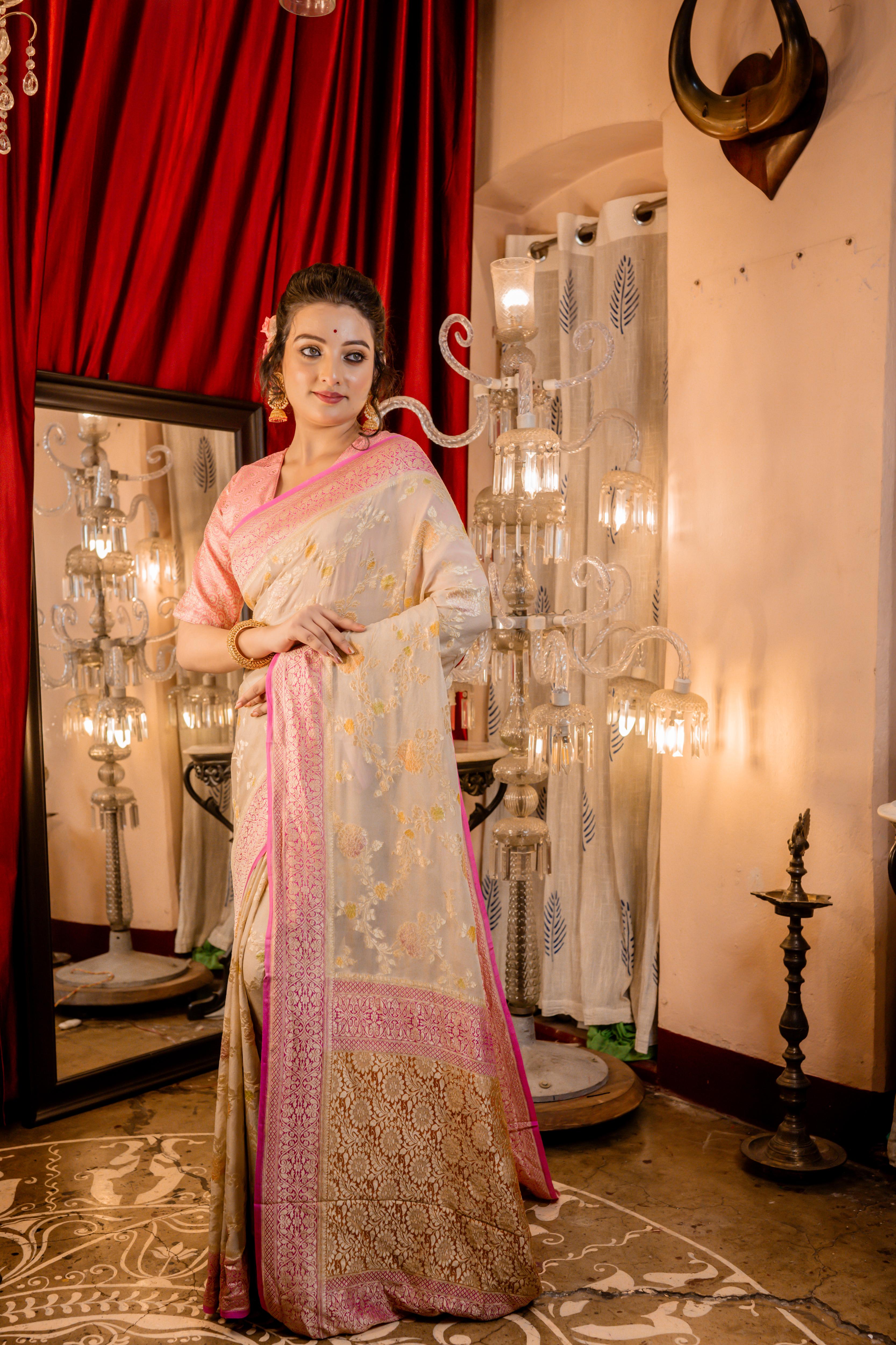 Barkha || Oyster Grey Khaddi Georgette Banarasi Saree with all over Rifling Handbrush Multi-colour & Matte Gold Zari Floral motif Jangla and Lilac Pink border